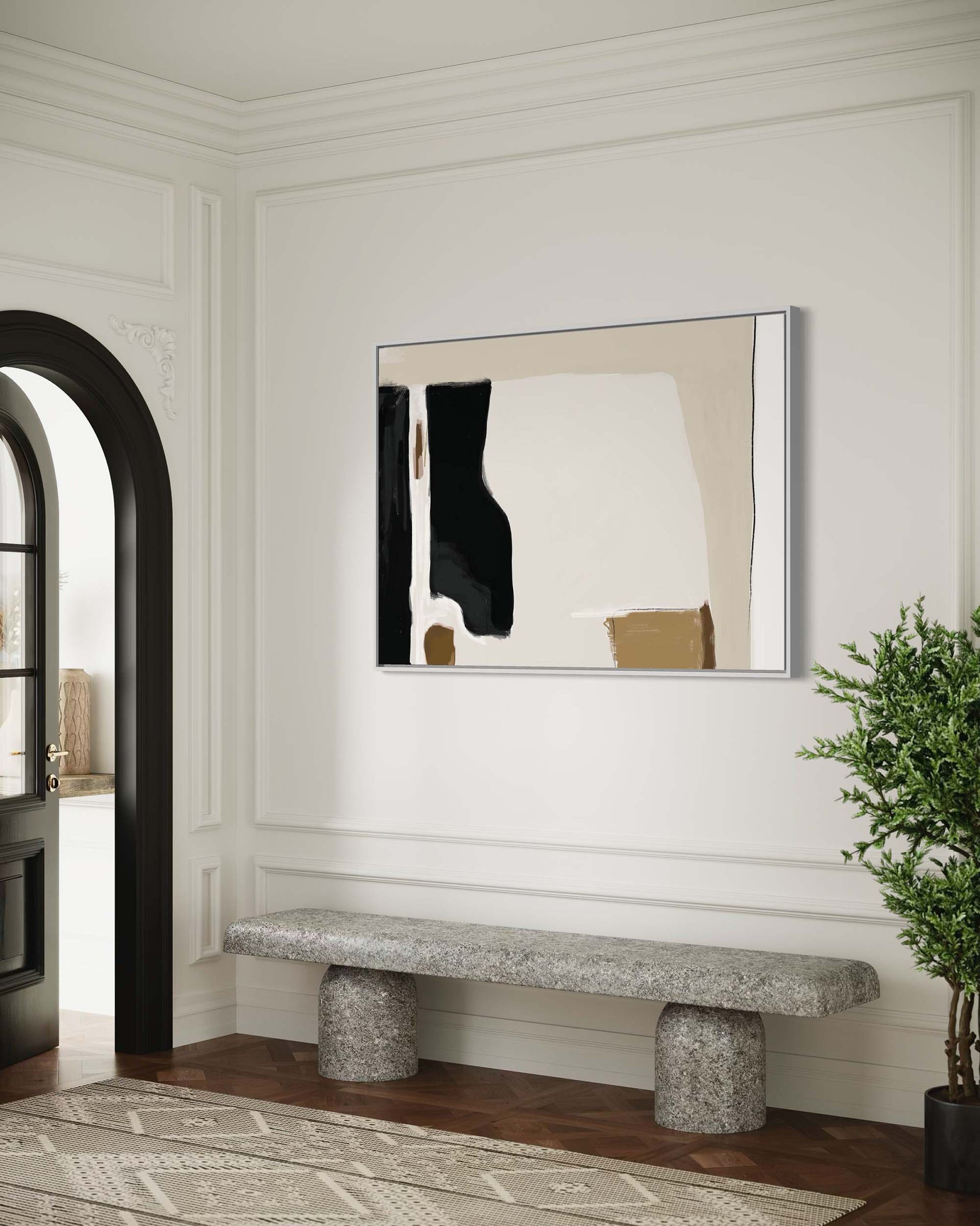 Modern interior with abstract art on the wall, stone bench, and plant.