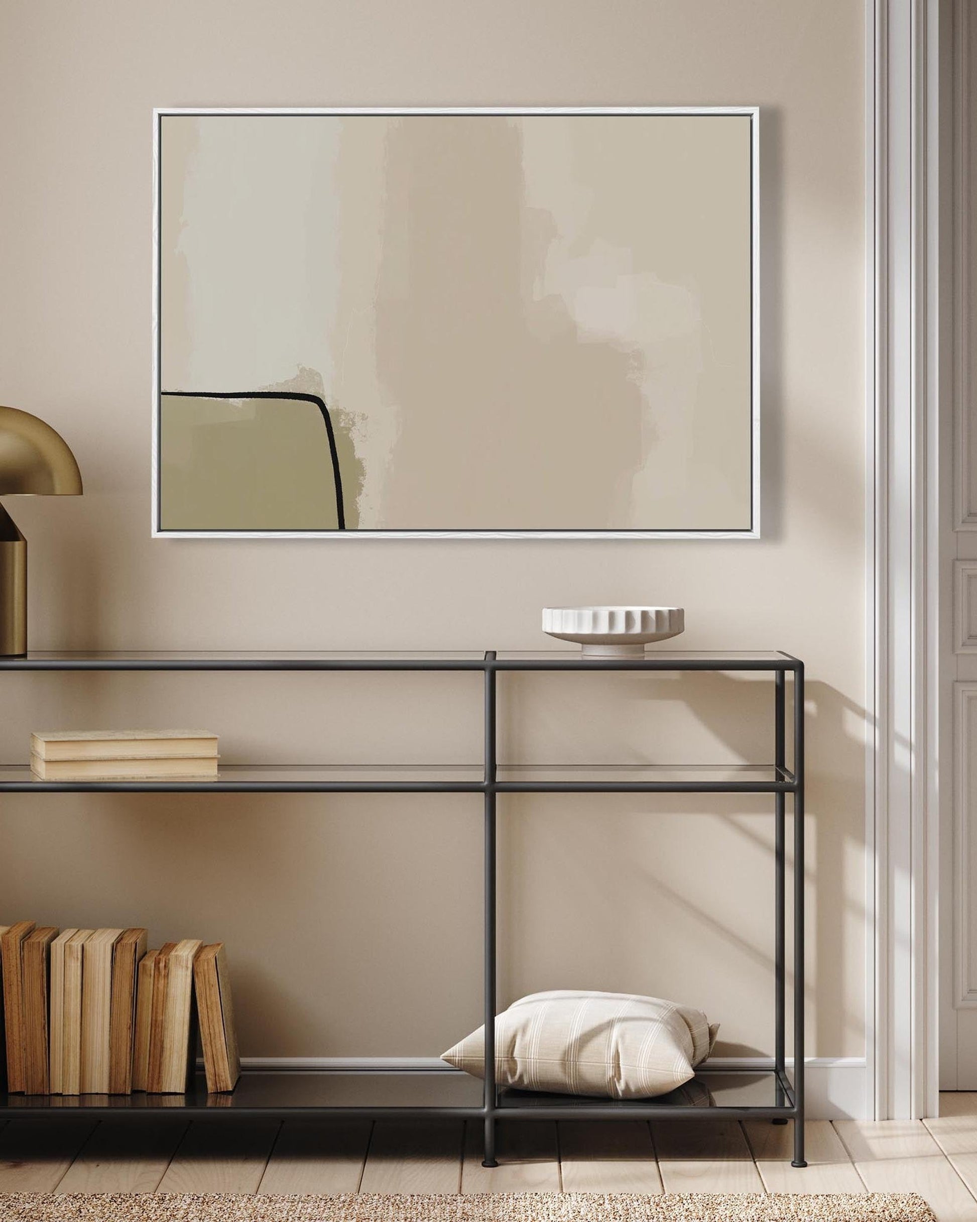 Modern interior with a console table, mirror, and decorative items against a beige wall.
