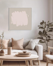 Modern living room with a white sofa, round coffee table, and abstract art on the wall.