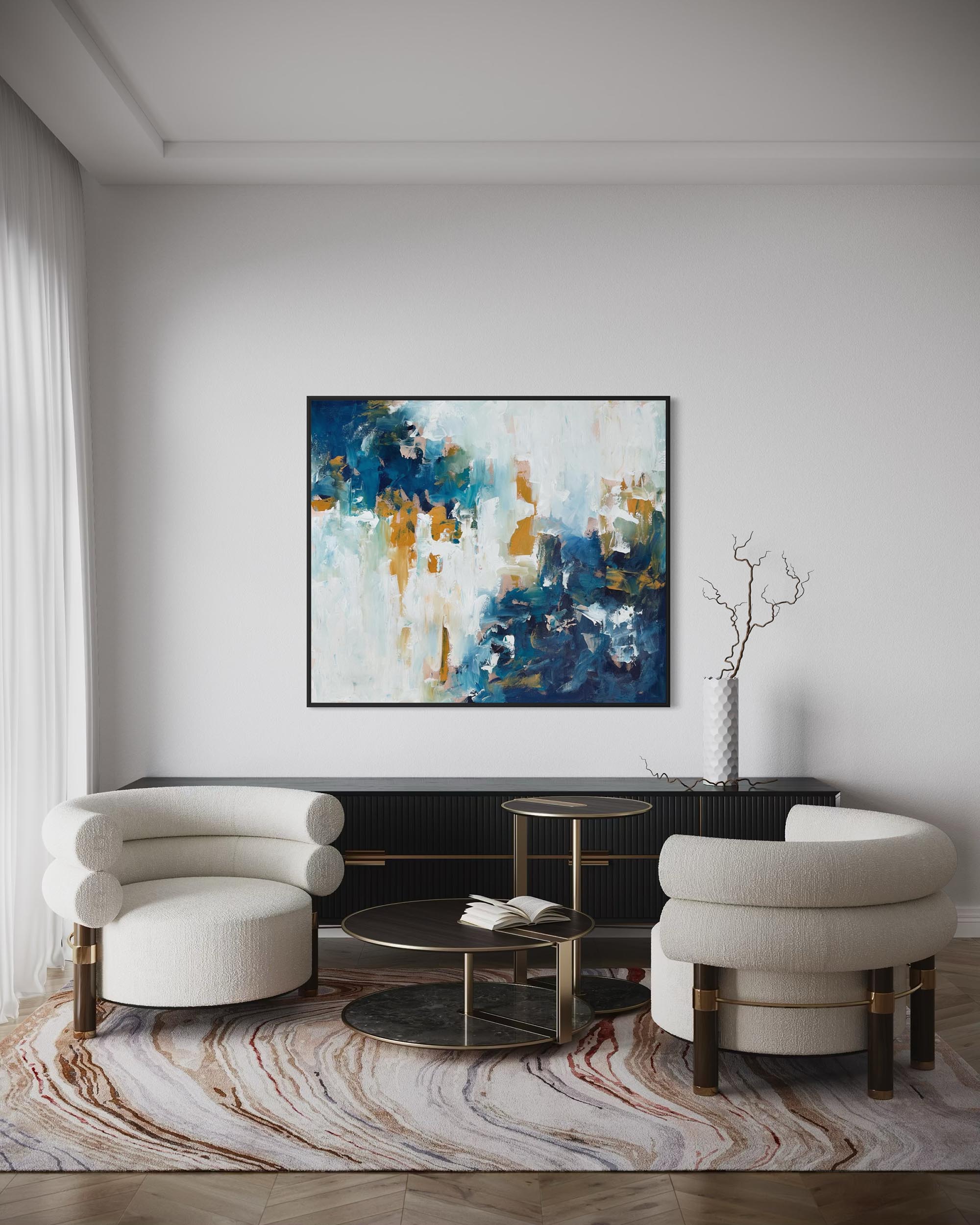 Modern living room with abstract art, white chairs, and a coffee table.
