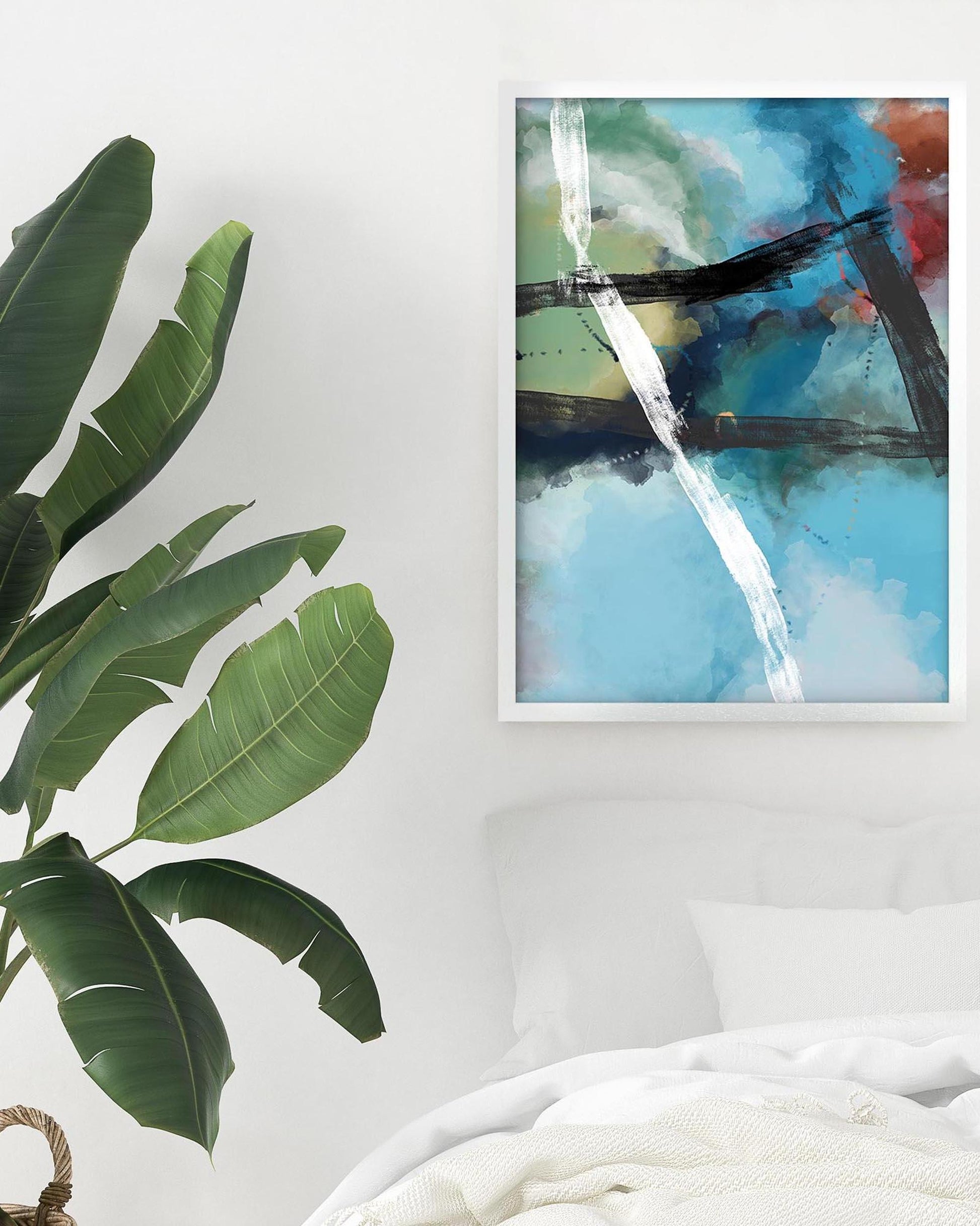Abstract painting on a wall with a plant and white surface in the foreground