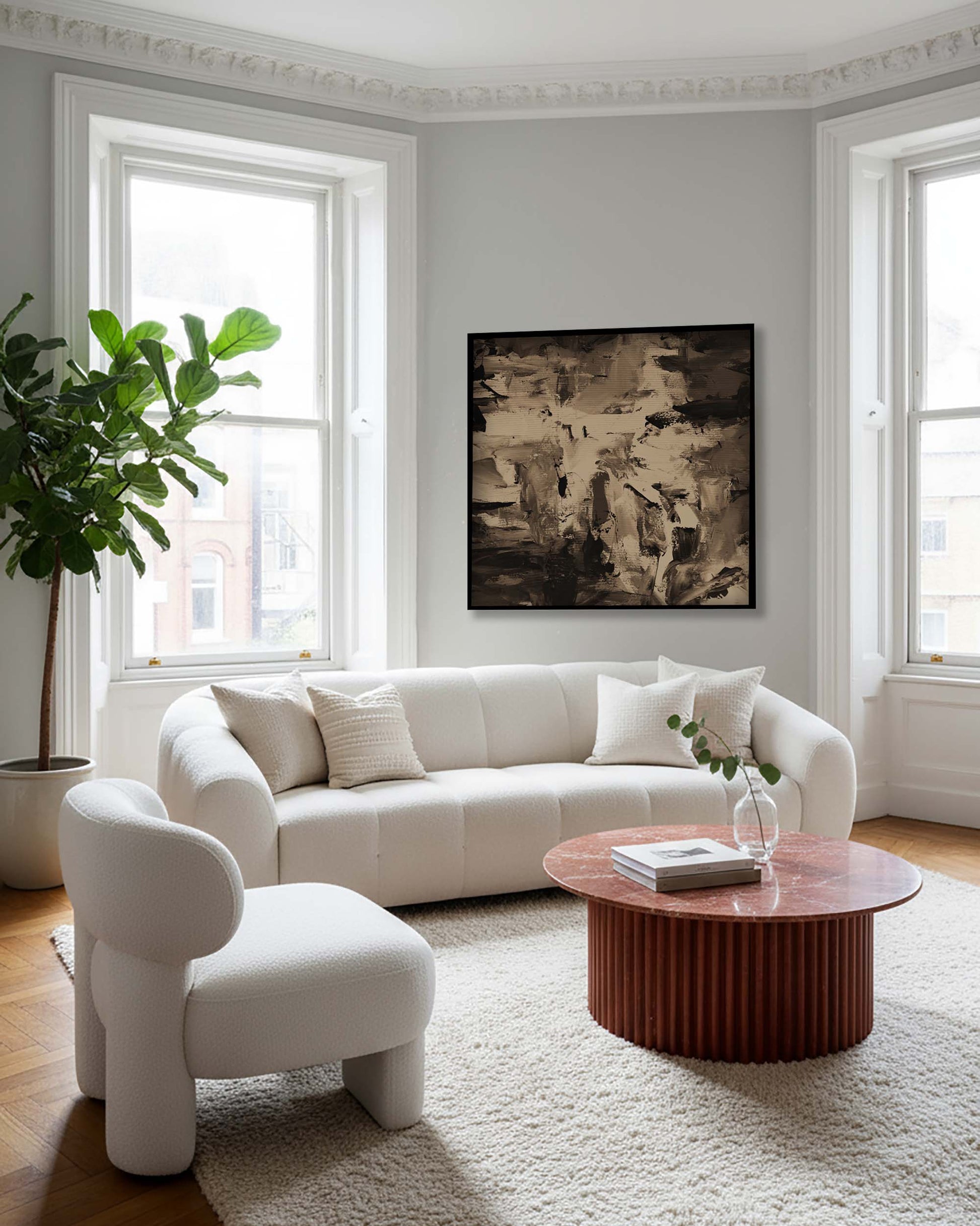 Modern living room with white sofa, armchair, and wooden coffee table.