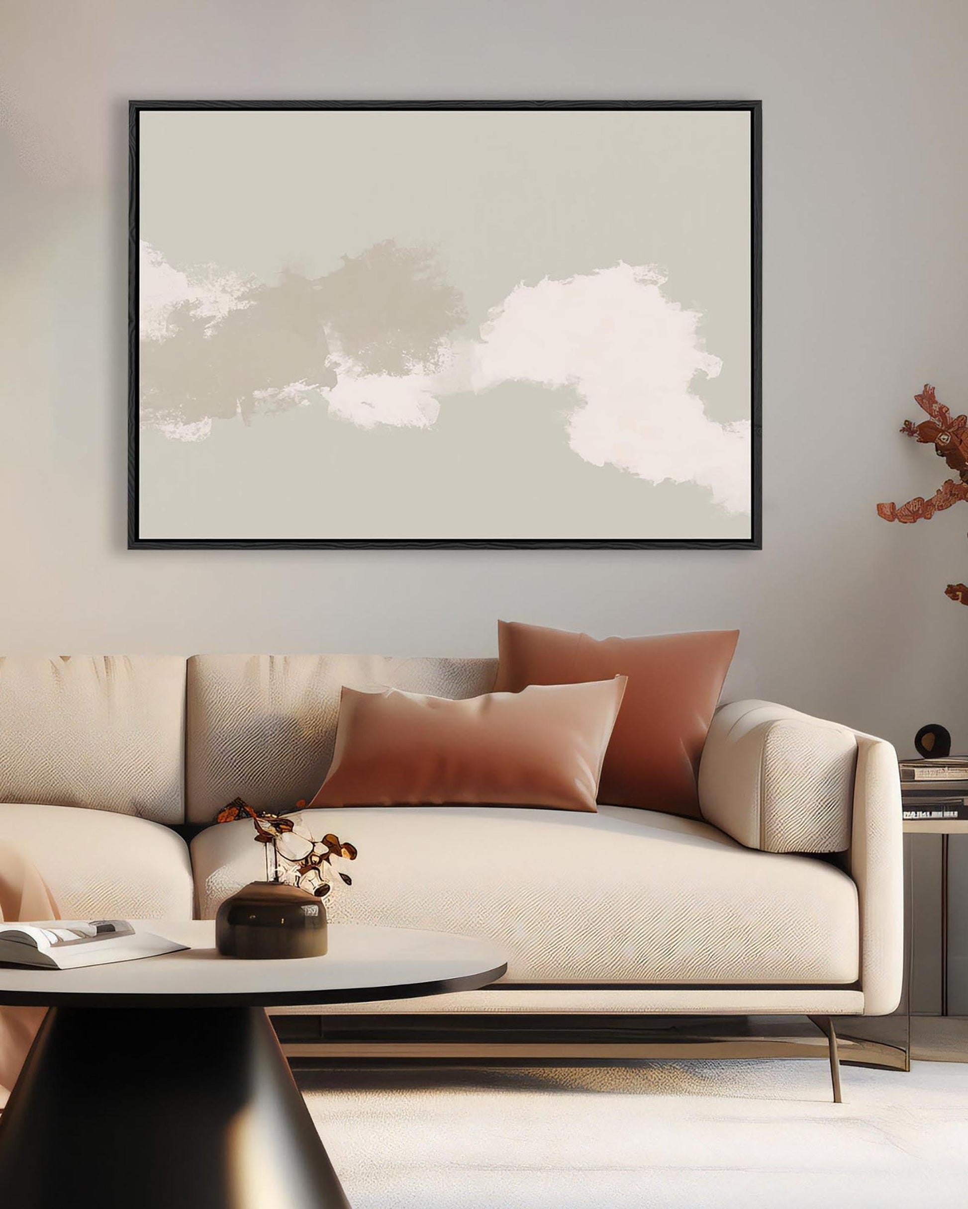 Modern living room with a beige sofa, abstract art, and decorative elements.