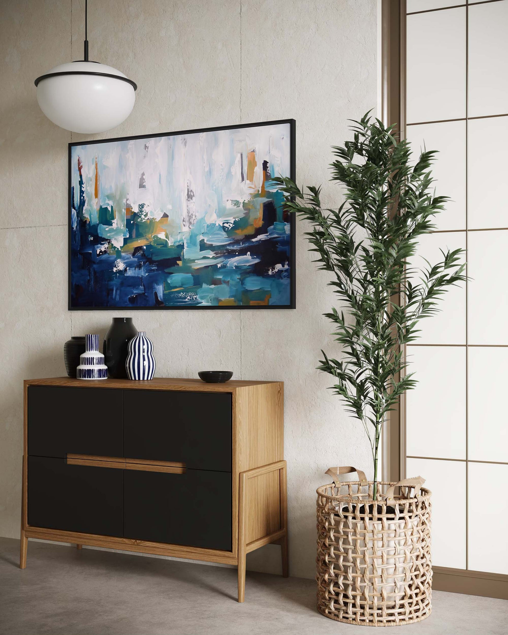 Modern interior with a dresser, abstract painting, and plant.