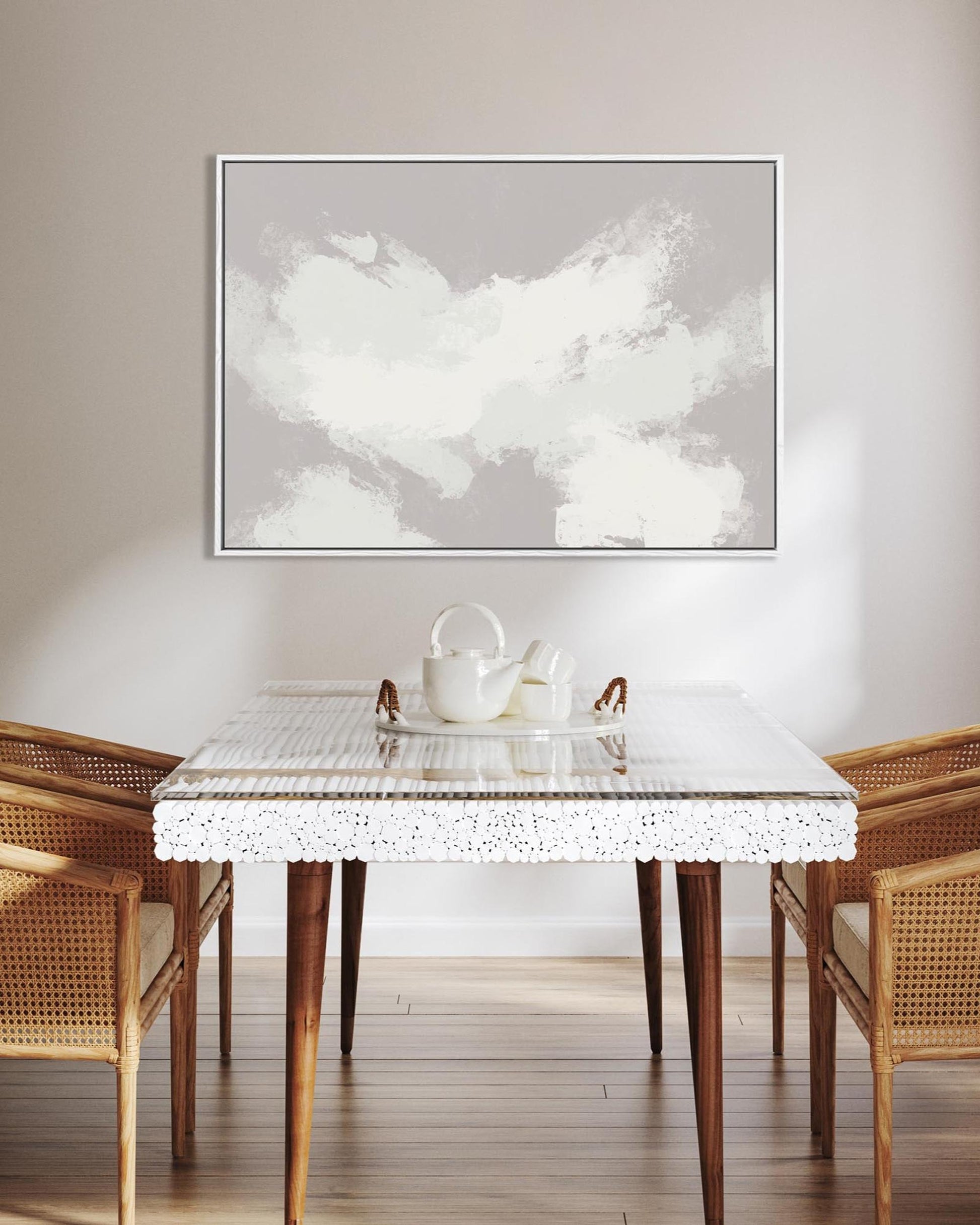 Dining room with a marble table, wicker chairs, and a framed abstract artwork on the wall.