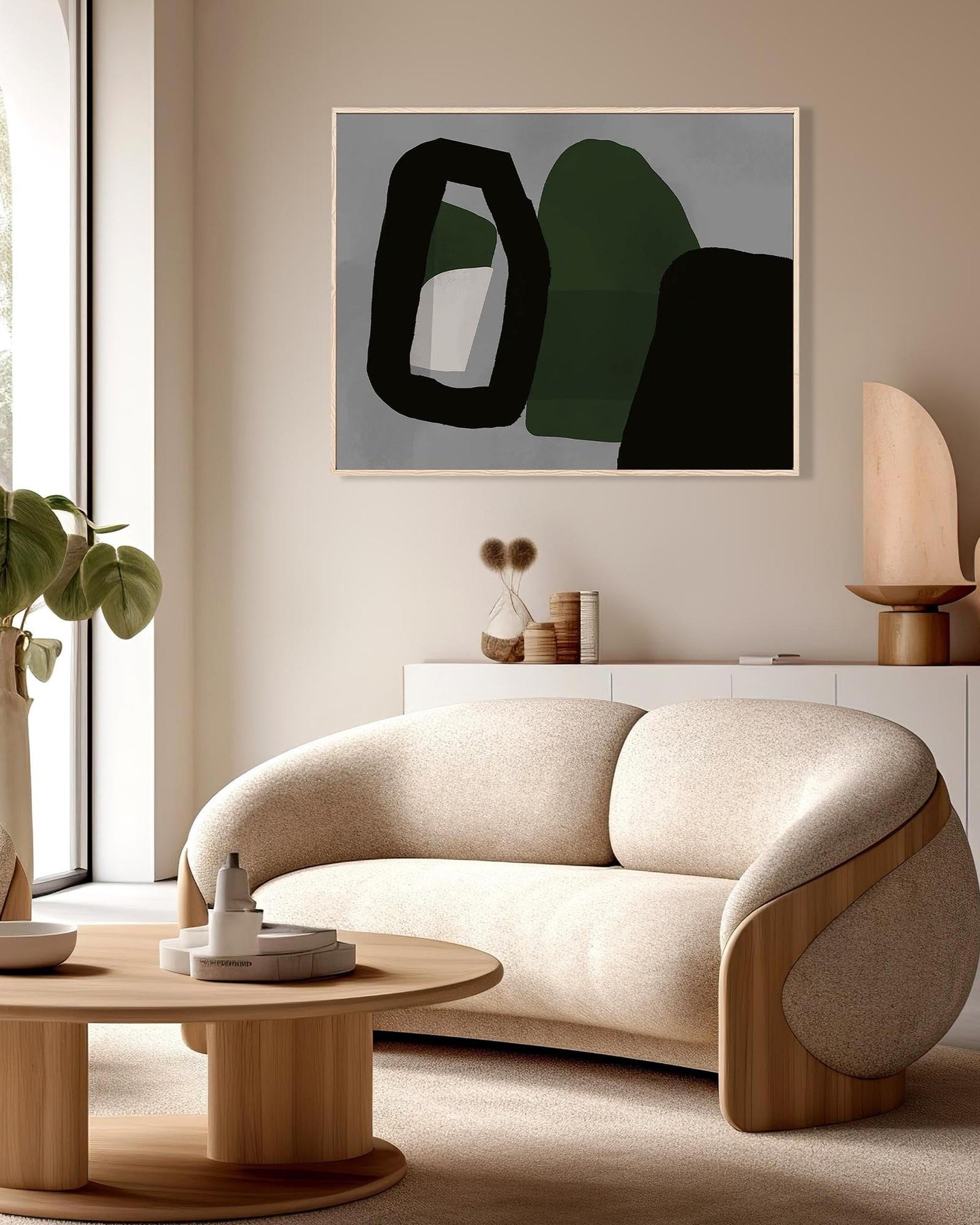 Modern living room with a beige sofa, abstract art, and decorative items.