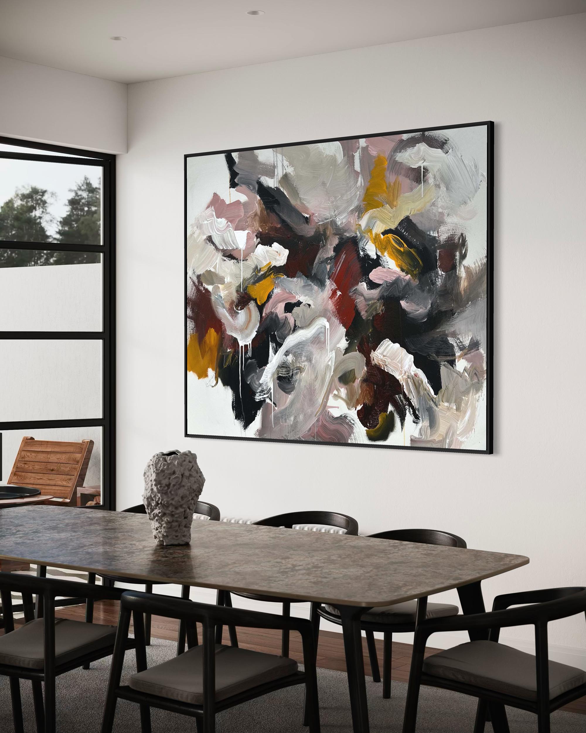 Modern dining room with abstract art on the wall