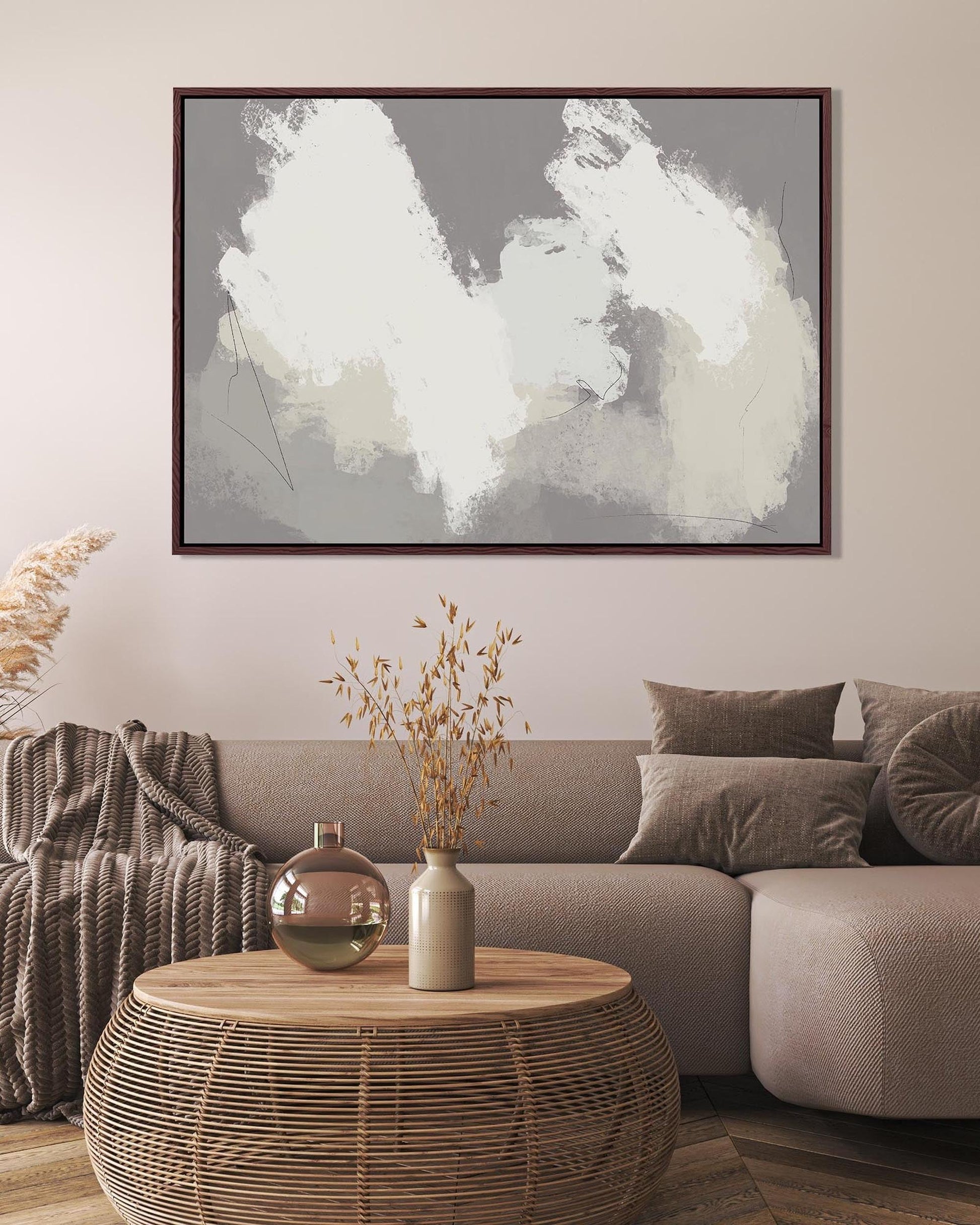 Living room with abstract art on the wall, sofa, and coffee table.