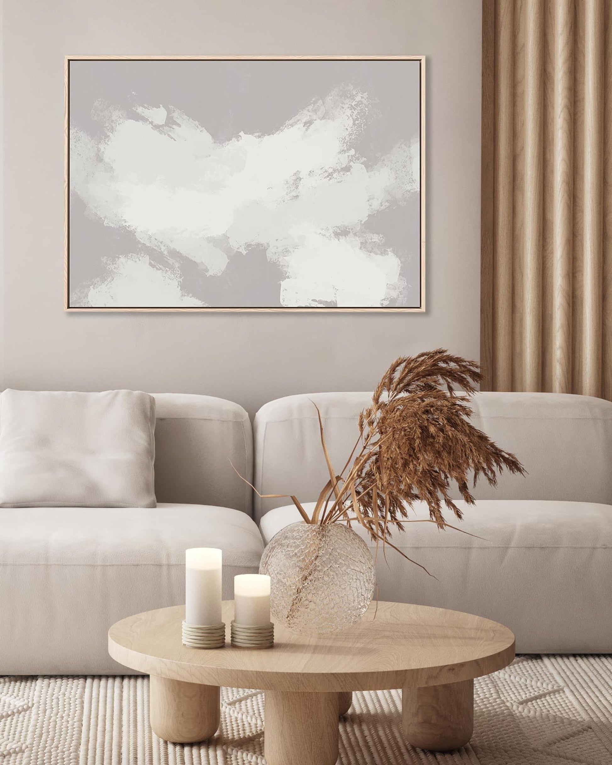 Modern living room with a neutral color scheme, featuring a sofa, coffee table, and abstract art.