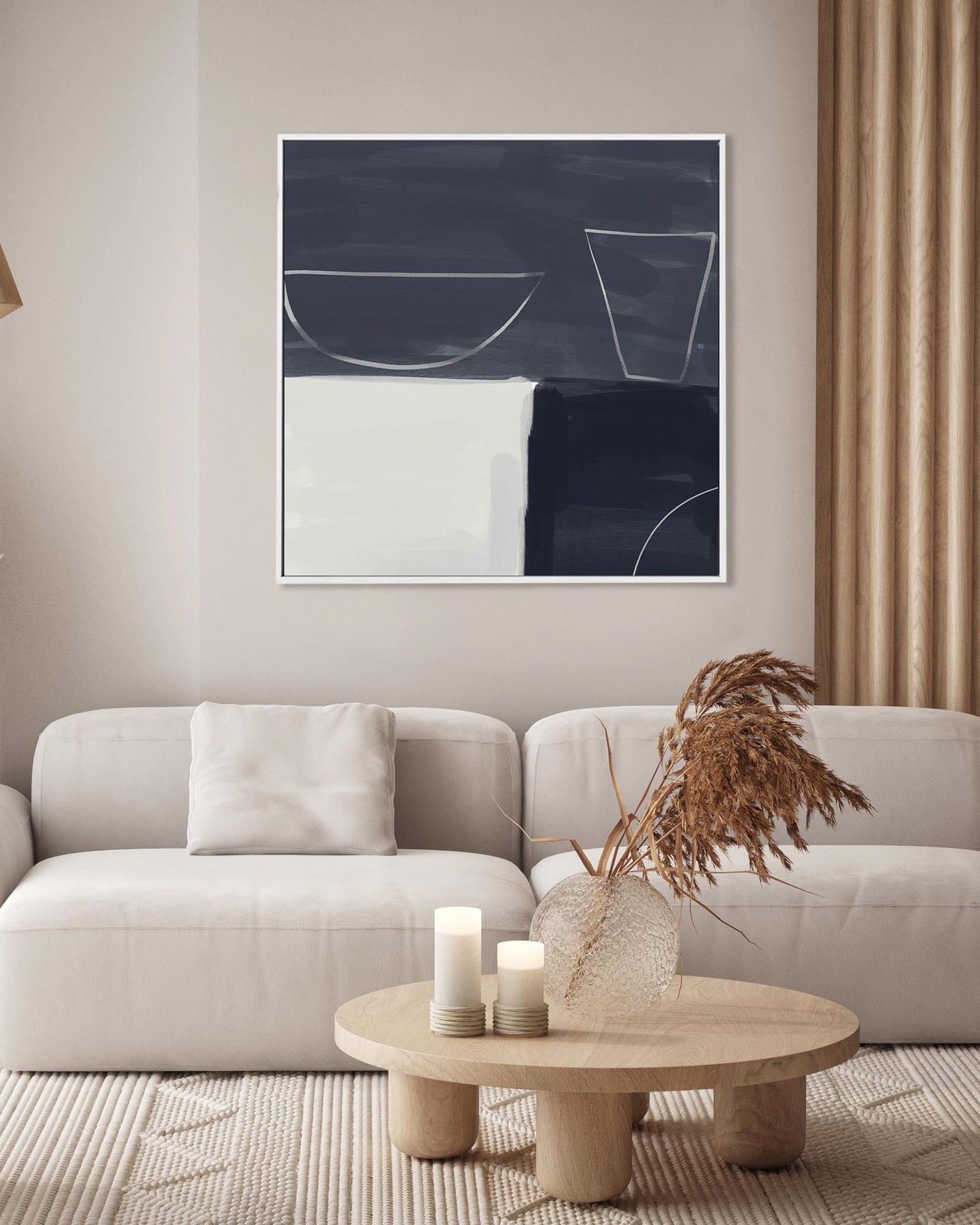 Modern living room with a neutral color scheme, featuring a abstract art piece on the wall above a beige sofa.