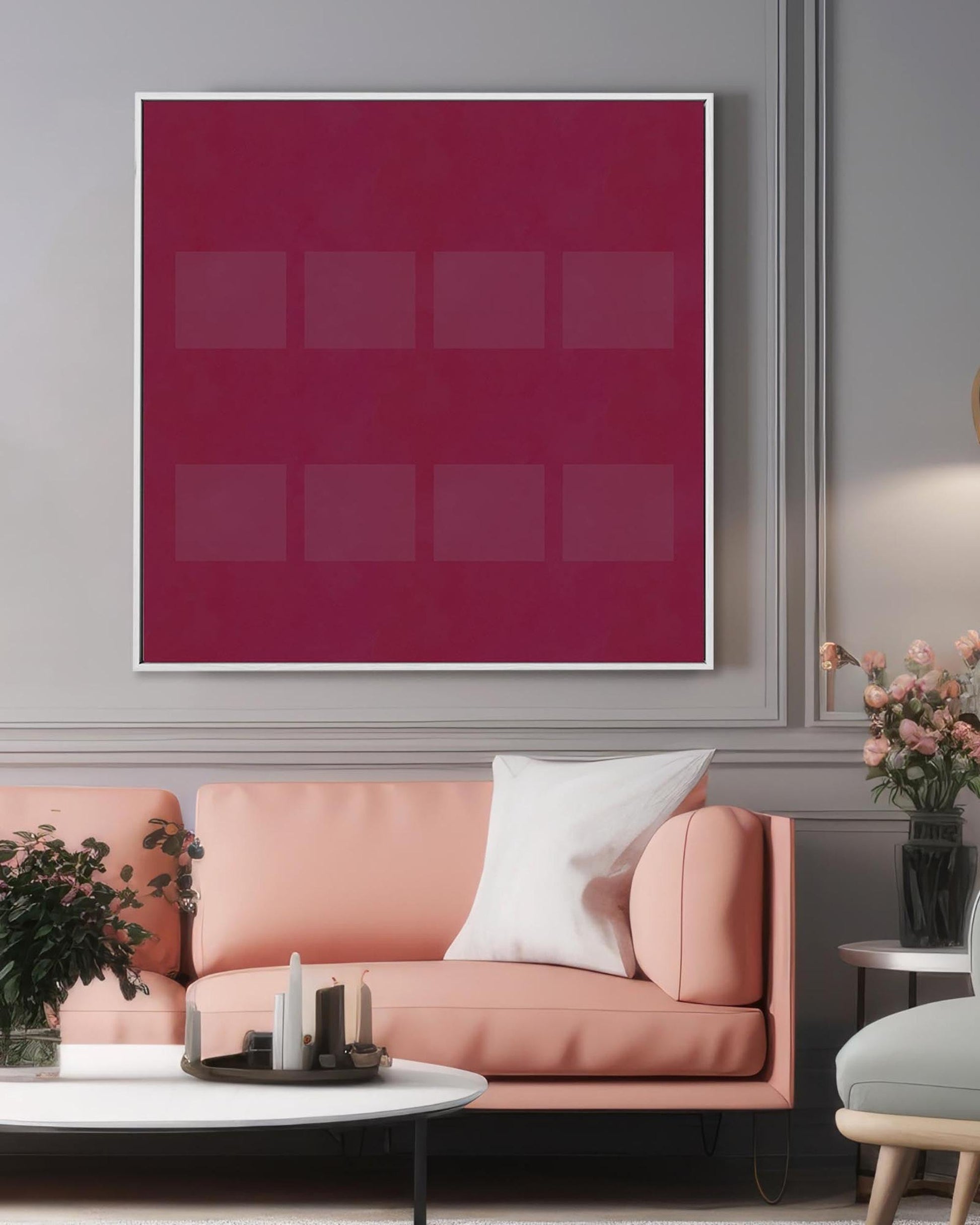 Modern living room with a pink sofa, coffee table, and abstract art on the wall.