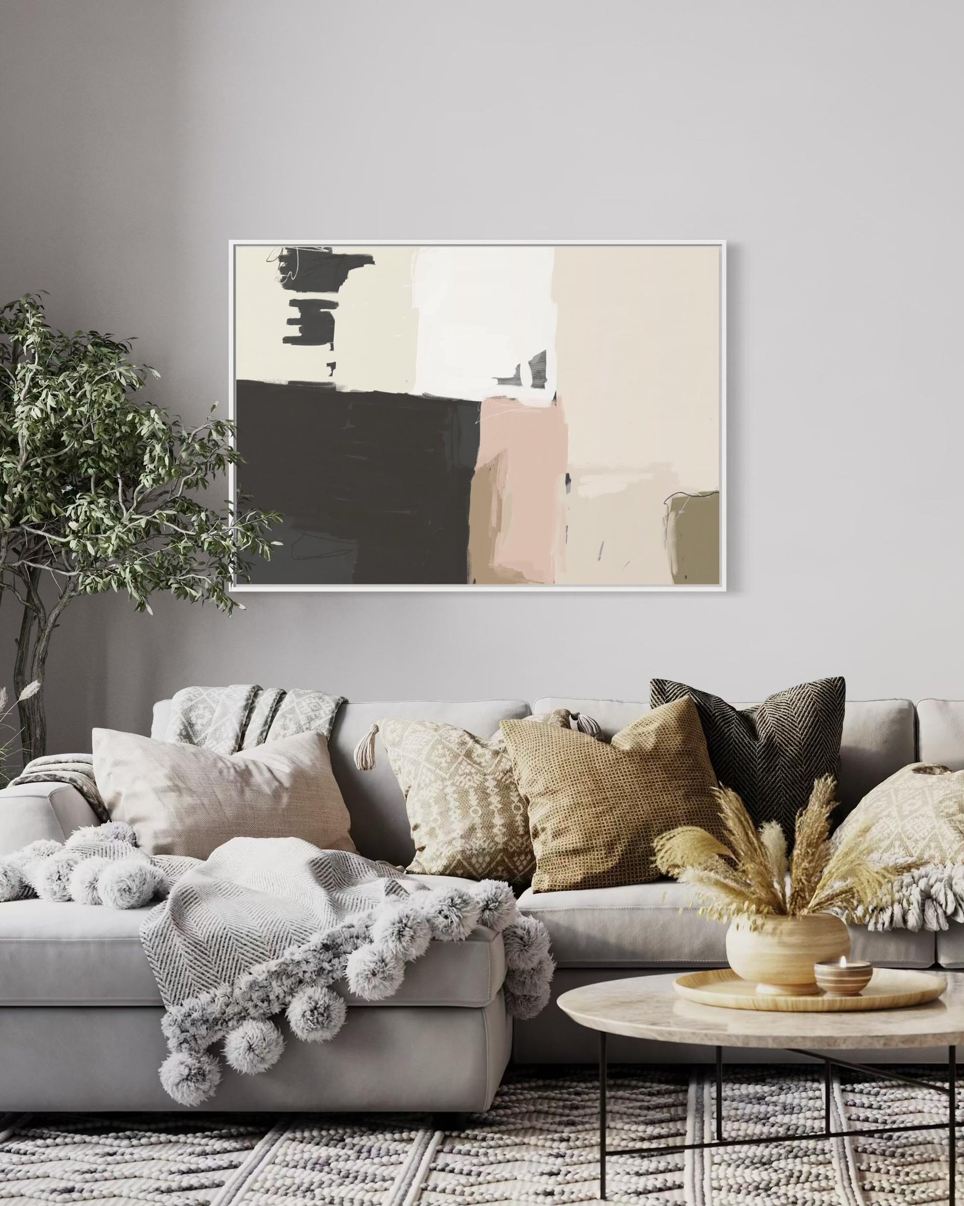 Living room with a gray sofa, decorative pillows, and a abstract painting on the wall.