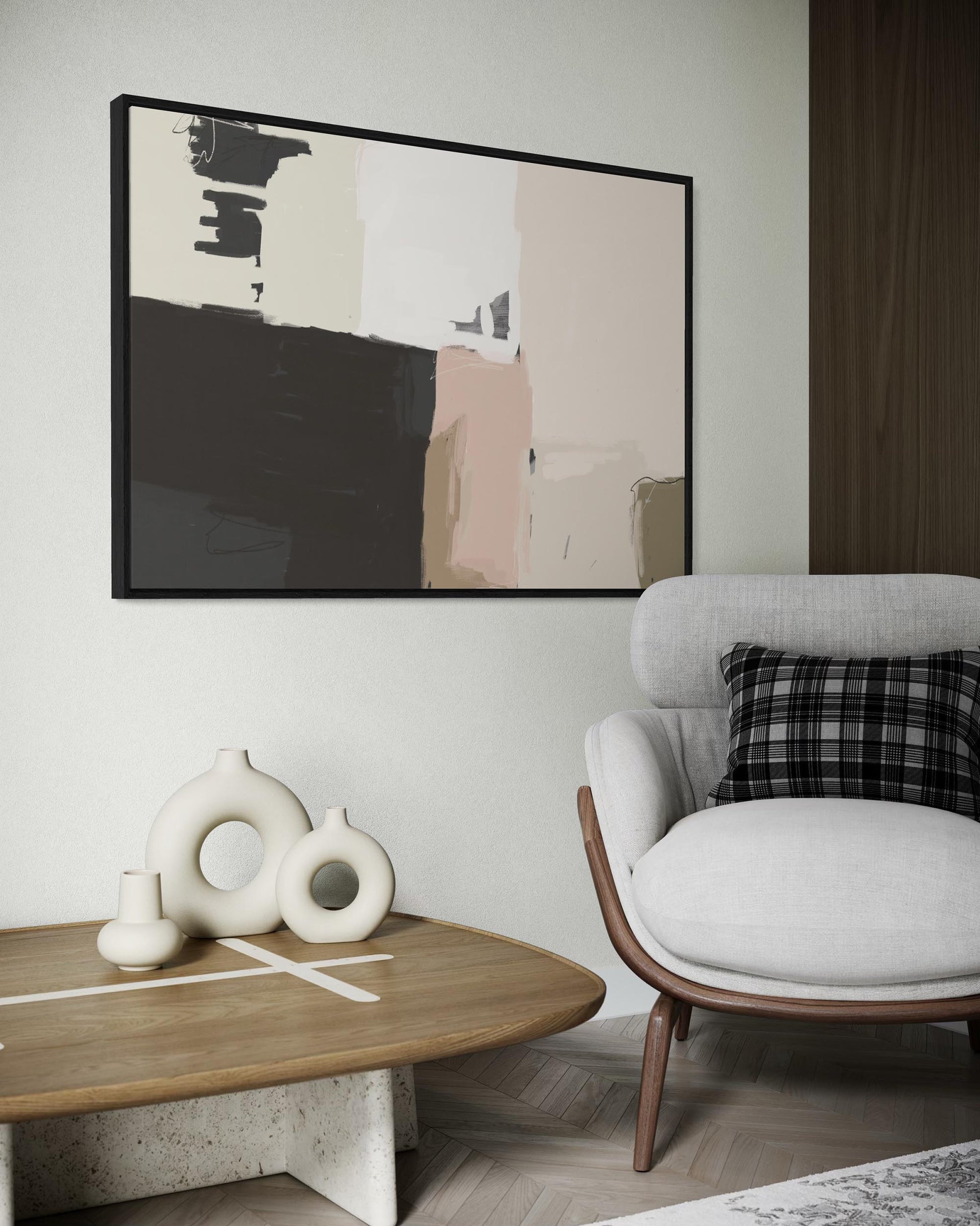 Modern living room with abstract art, white sofa, and wooden coffee table.