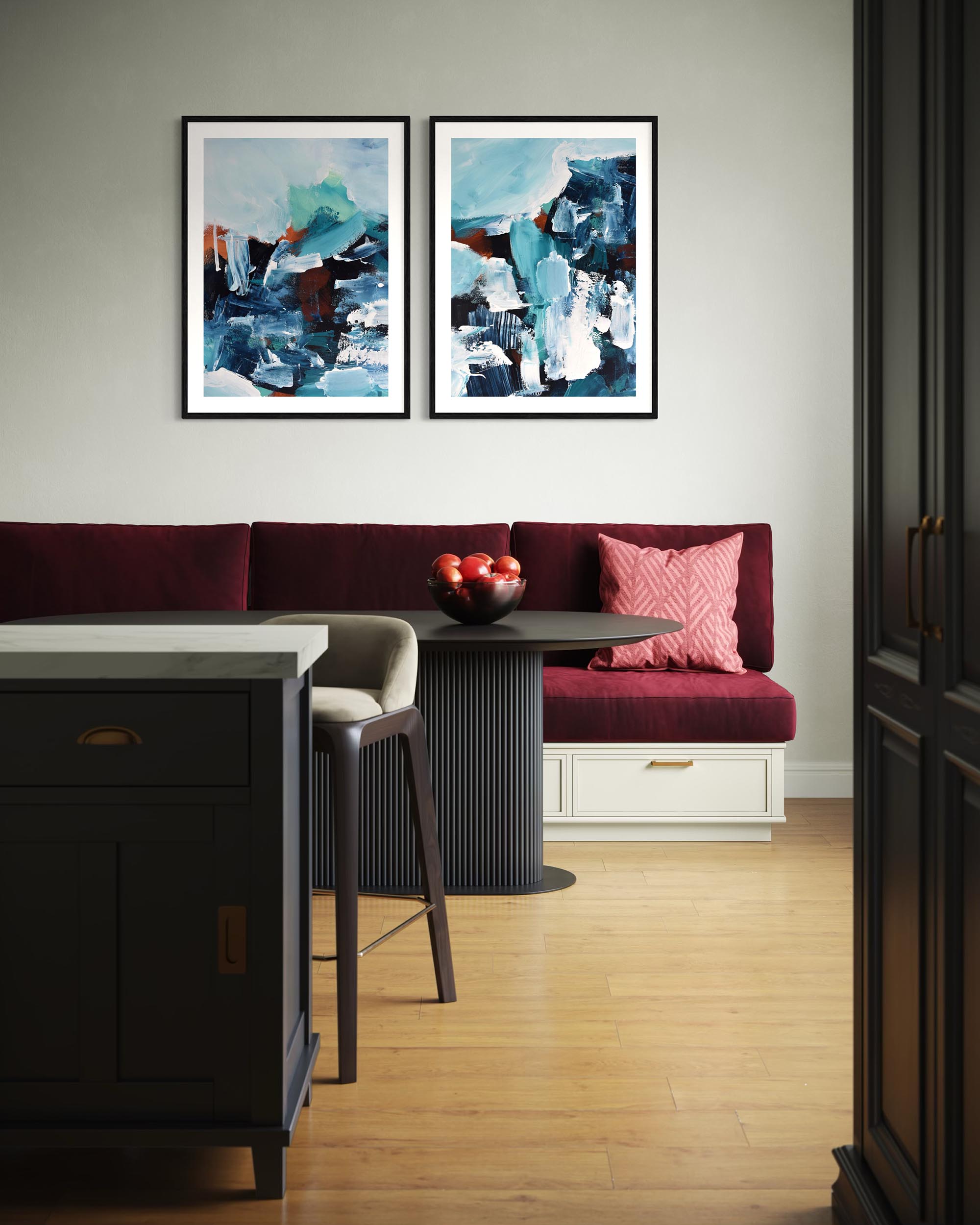 Modern kitchen with red bench, marble island, and abstract art on the wall.