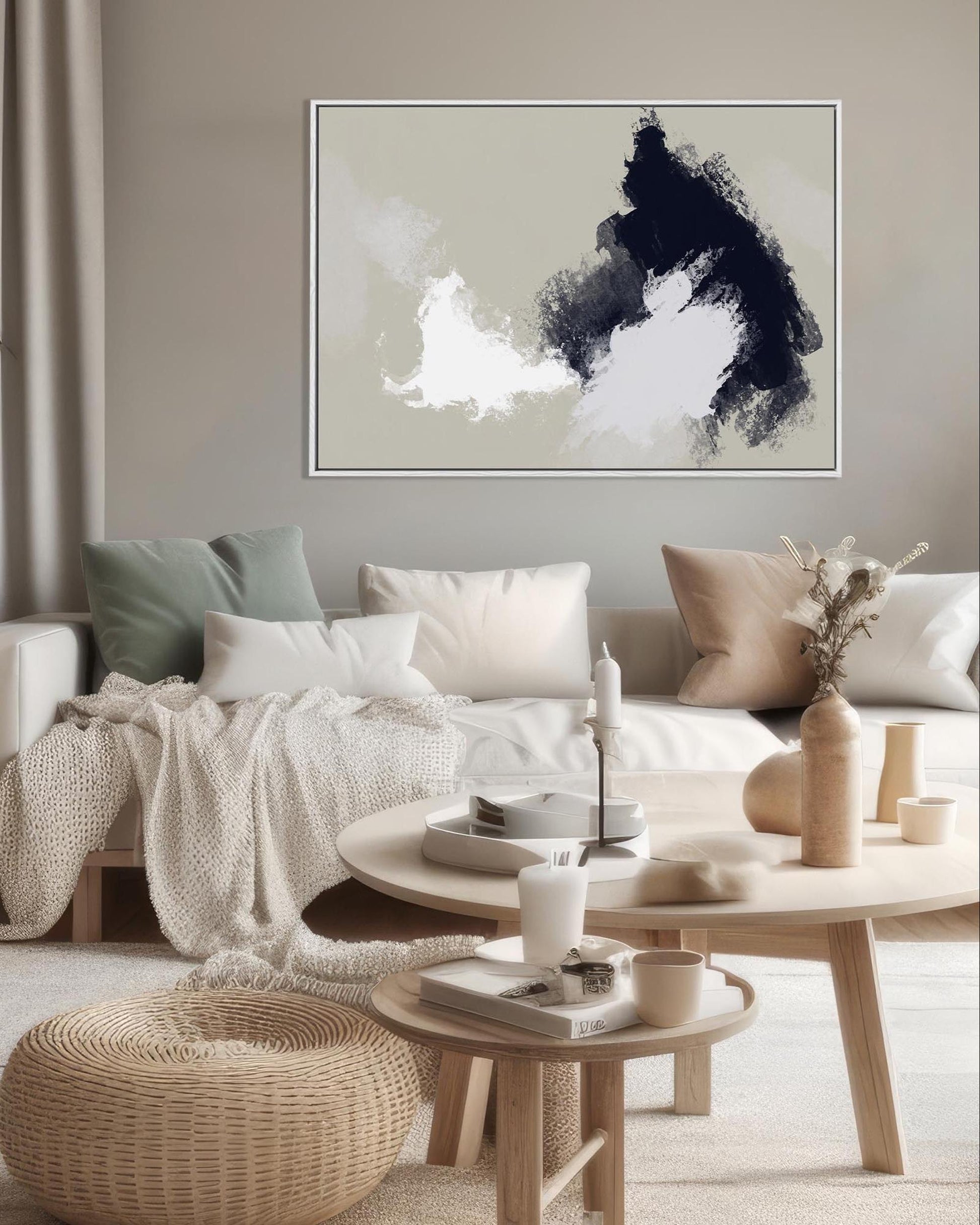 Modern living room with a sofa, coffee table, and abstract art on the wall.