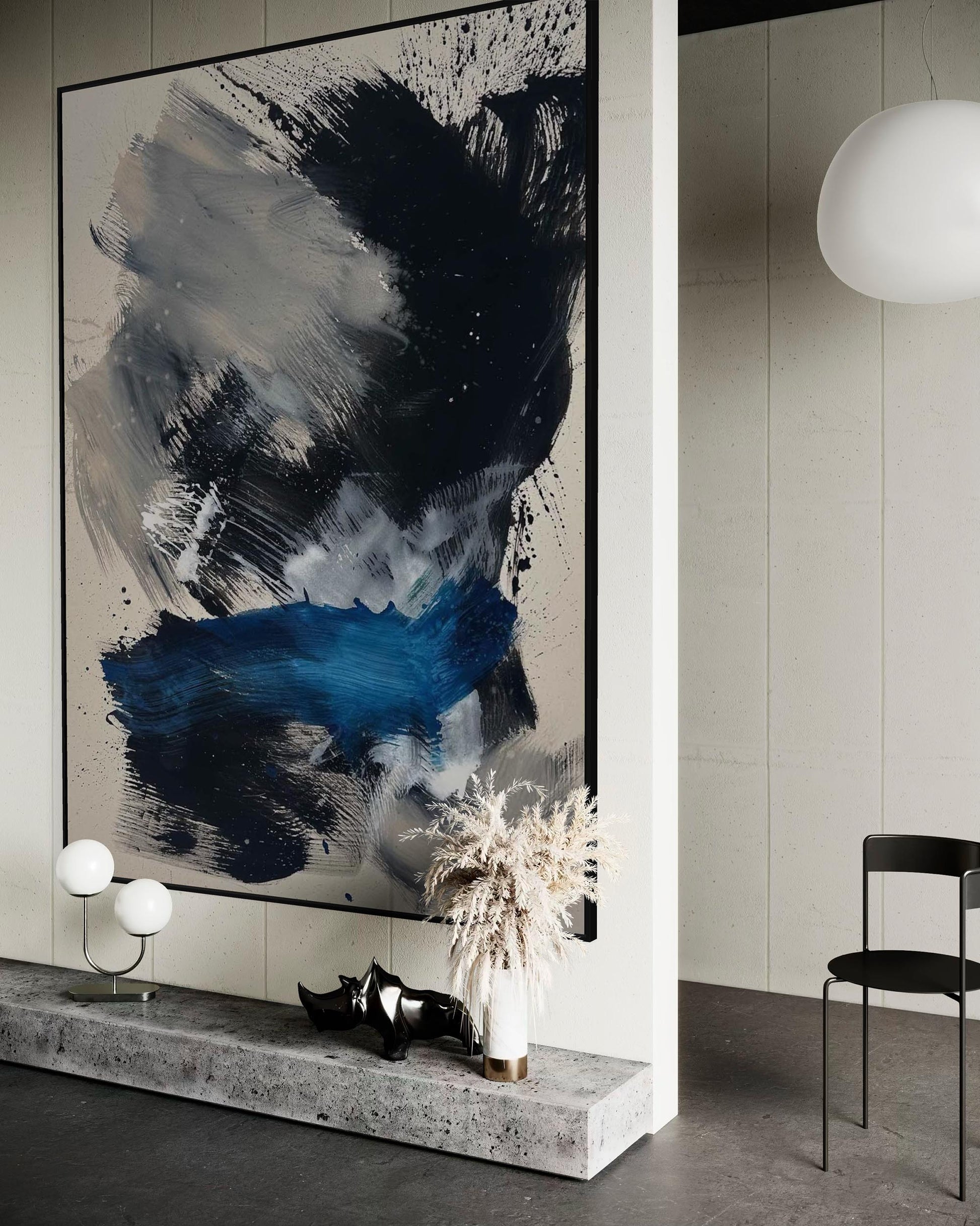 Abstract painting in a modern interior setting with decor elements.