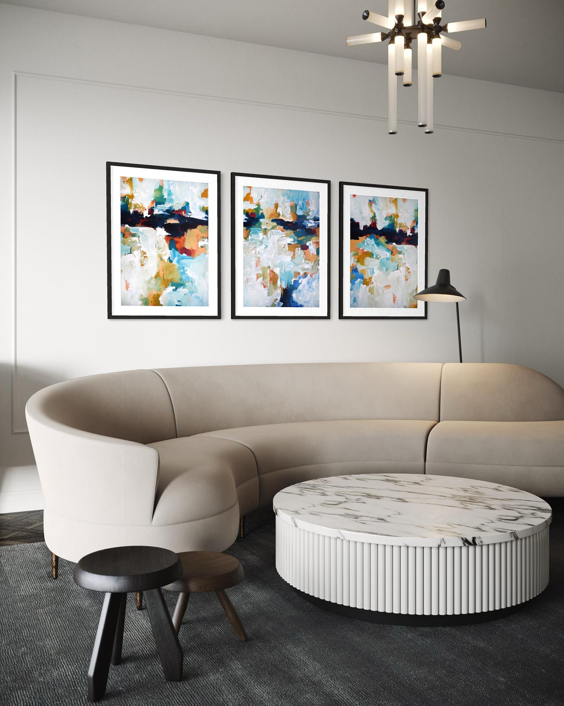 Modern living room with a beige sectional sofa, marble coffee table, and abstract art on the wall.