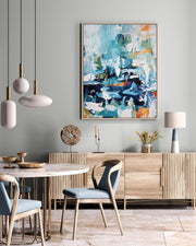Modern dining room with wooden furniture, abstract art, and pendant lights.