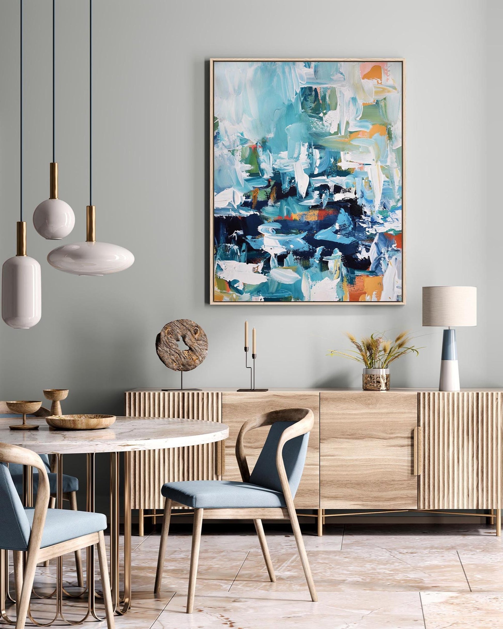 Modern dining room with wooden furniture, abstract art, and pendant lights.