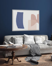 Living room with a gray sofa, abstract art on the wall, and a wooden coffee table.