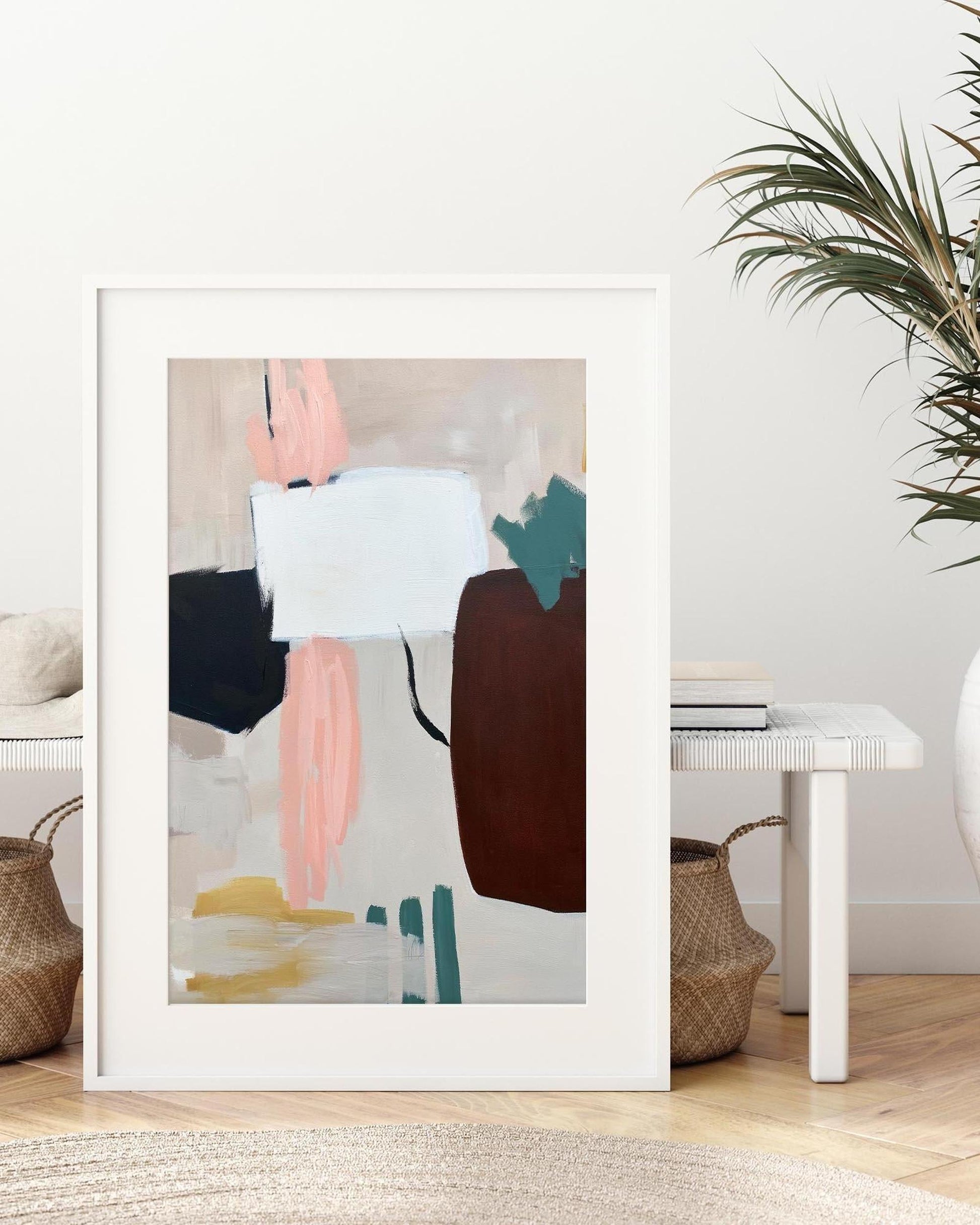 Framed abstract art print in a living room setting