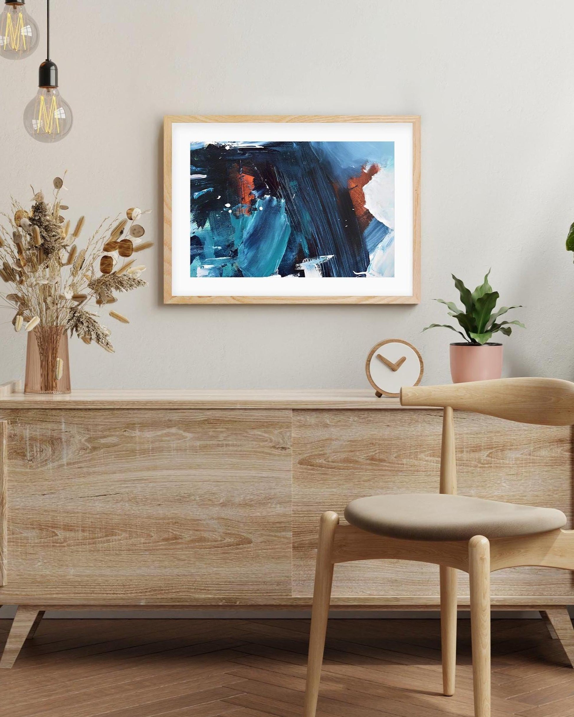 Modern interior with wooden furniture, abstract art, and decorative elements.