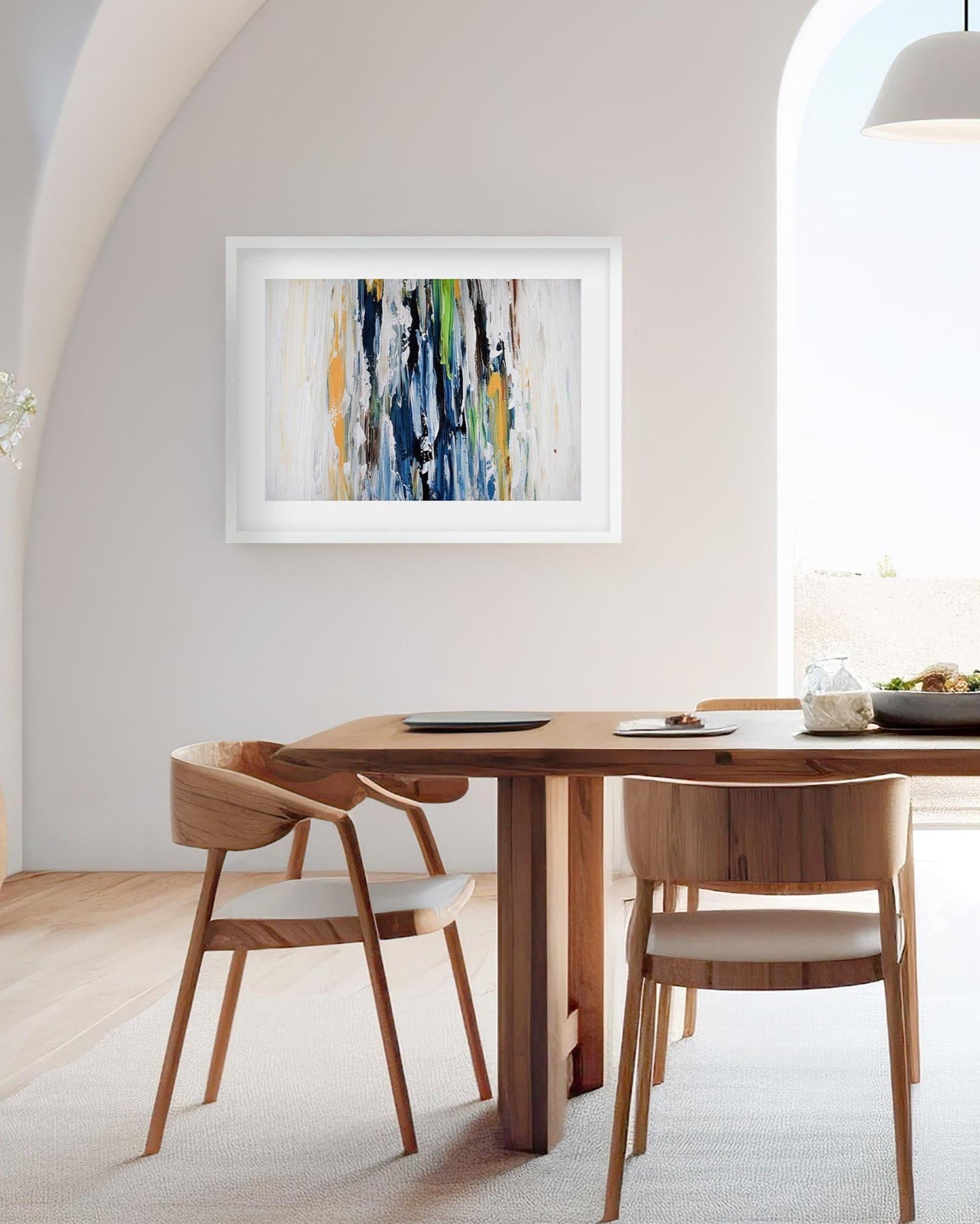 Dining room with wooden table and chairs, abstract painting on the wall.