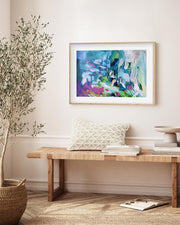 Living room with a wooden bench, decorative pillows, and a colorful abstract painting on the wall.