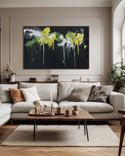 Modern living room with a gray sectional sofa, abstract painting, and decorative items.