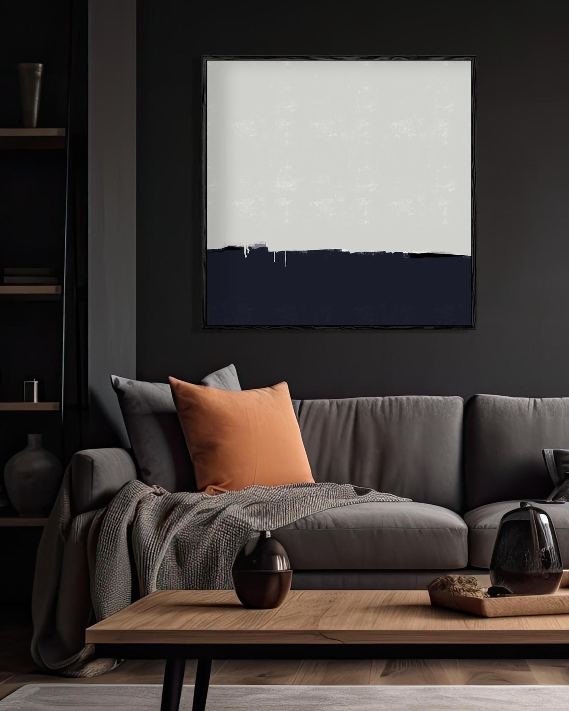 Modern living room with a gray sofa, wooden coffee table, and abstract art on the wall.