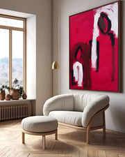 Modern abstract wall art painting on canvas. Unique oil painting with abstract figures in contemporary living room above sofa and footstool.