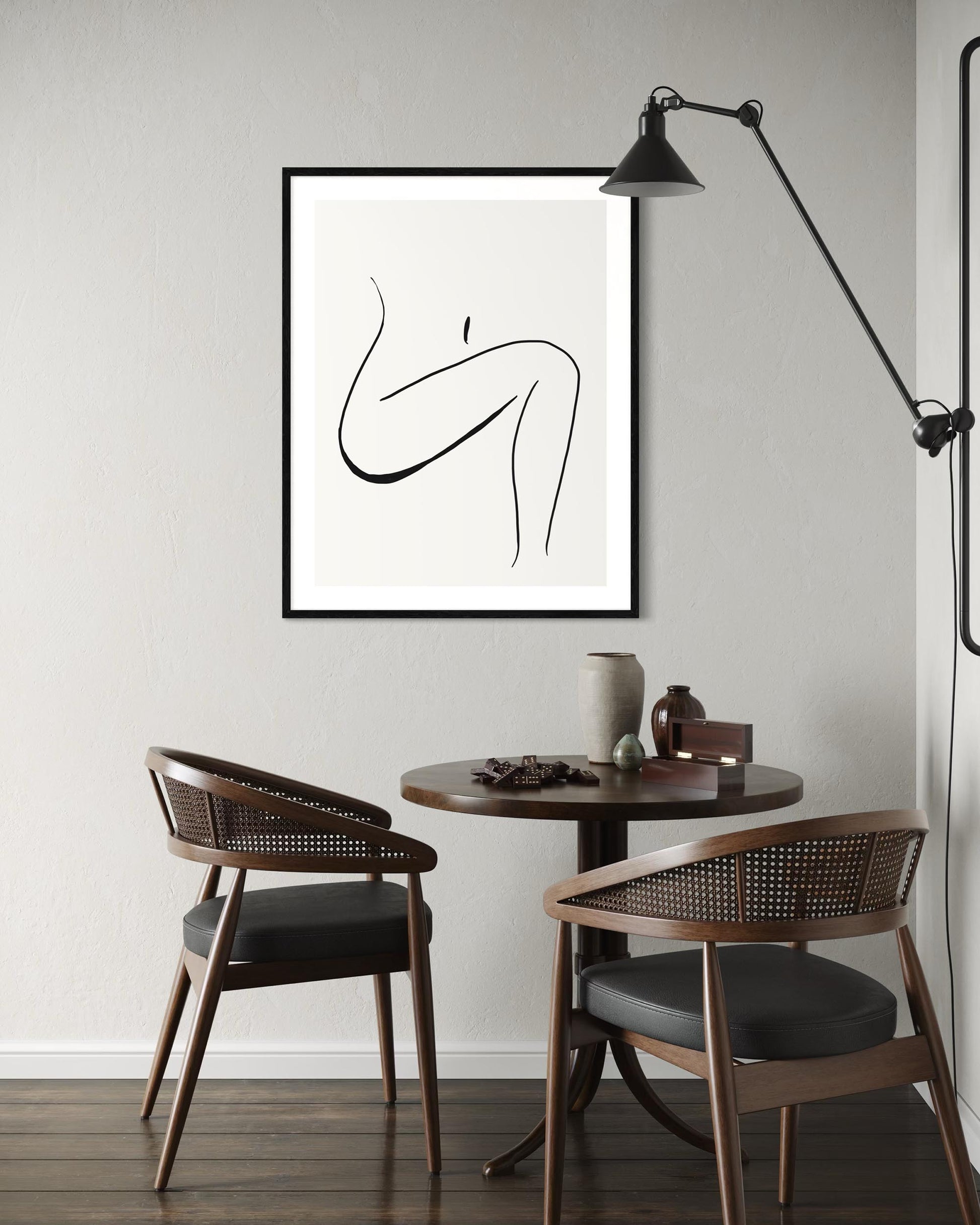 Modern interior with a table, chairs, and abstract art on the wall.