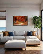 Living room with a gray sectional sofa, ottoman, and a painting of a forest scene on the wall.