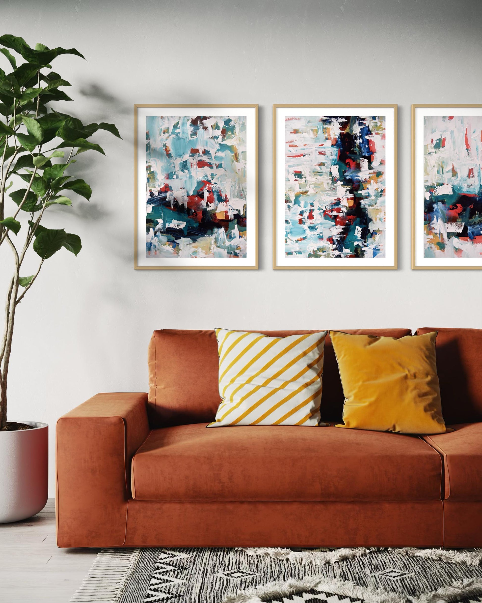 Living room with a brown sofa, abstract art on the wall, and decorative pillows.