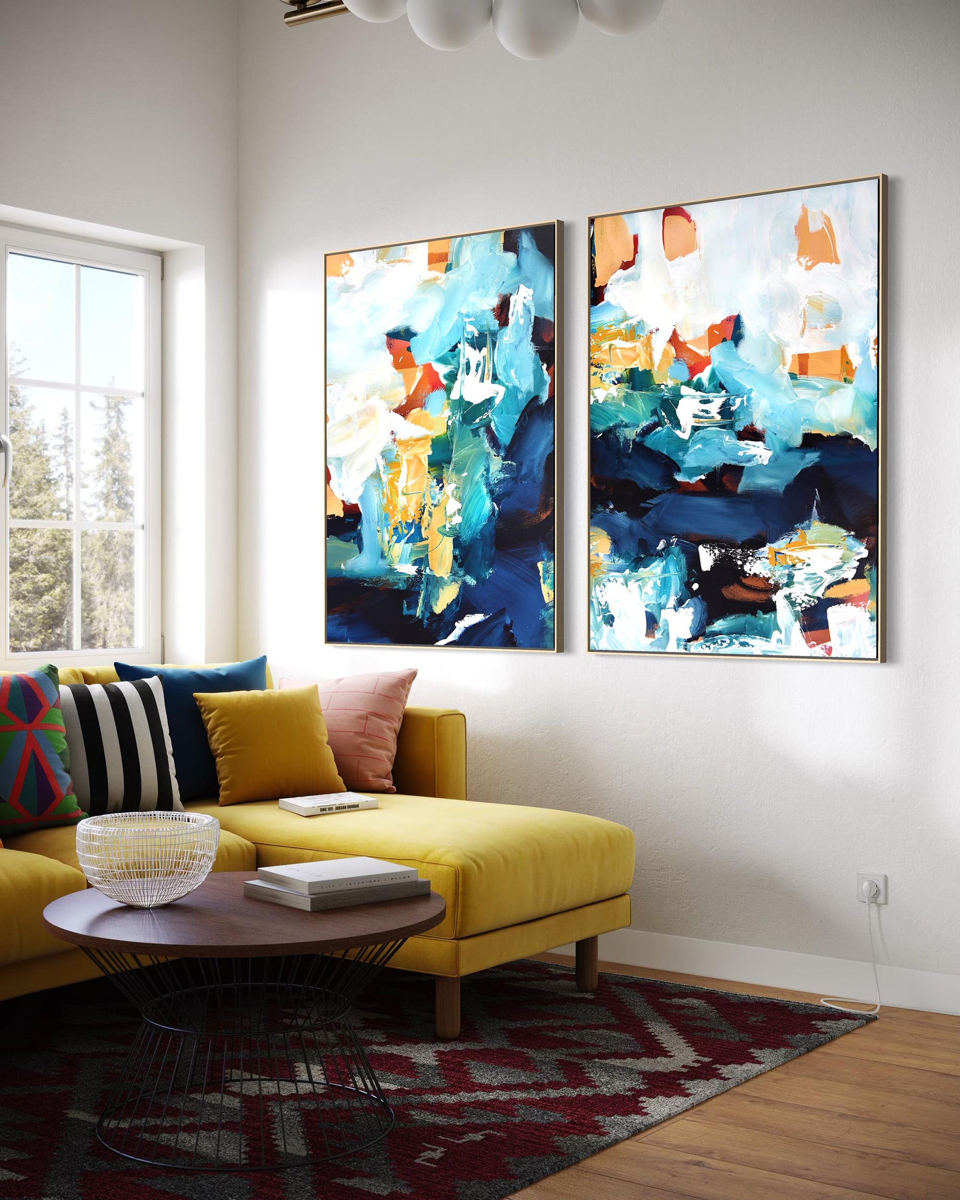 Living room with a yellow sofa, colorful pillows, and two abstract paintings on the wall.