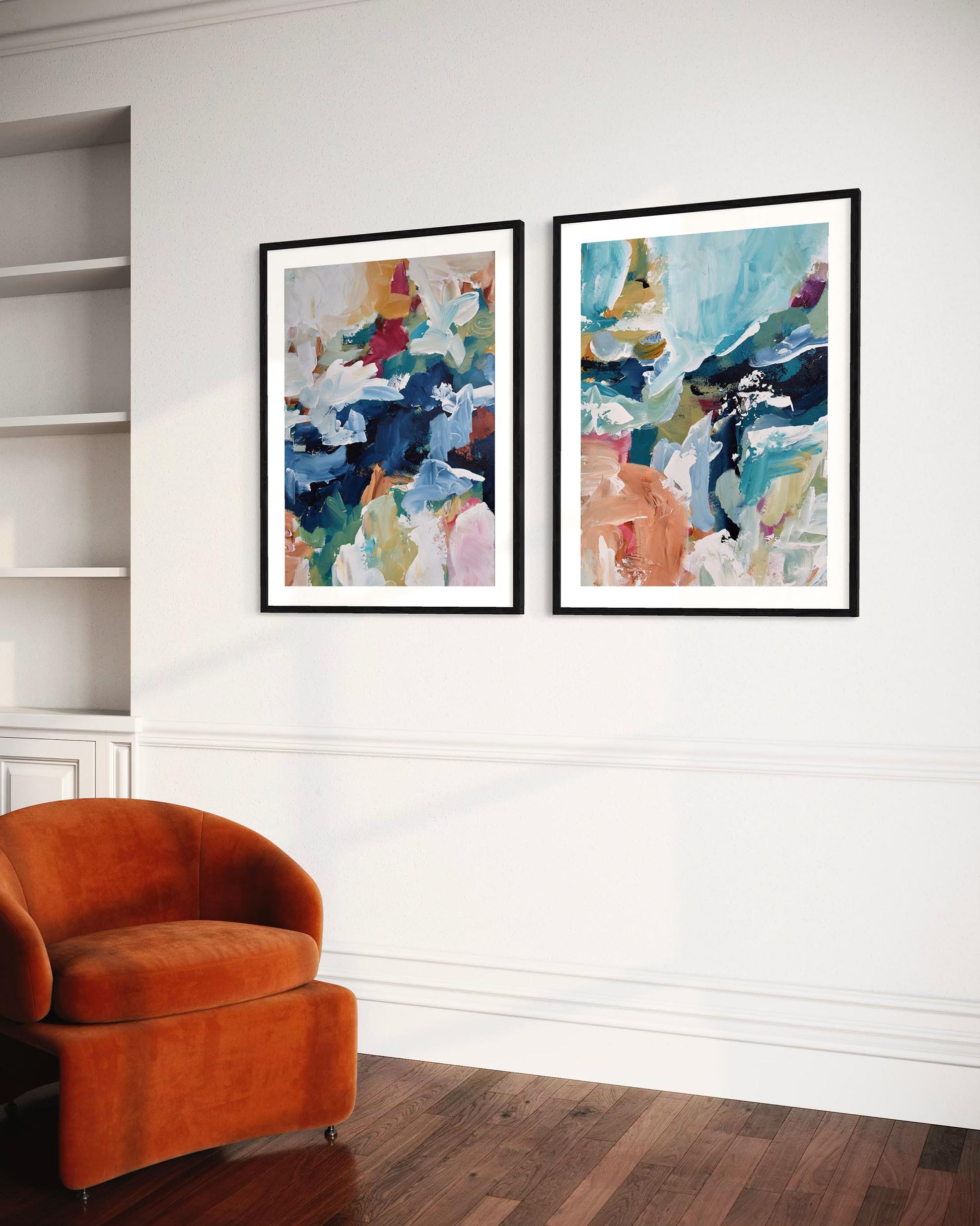 Two abstract art pieces on a wall above an orange chair.