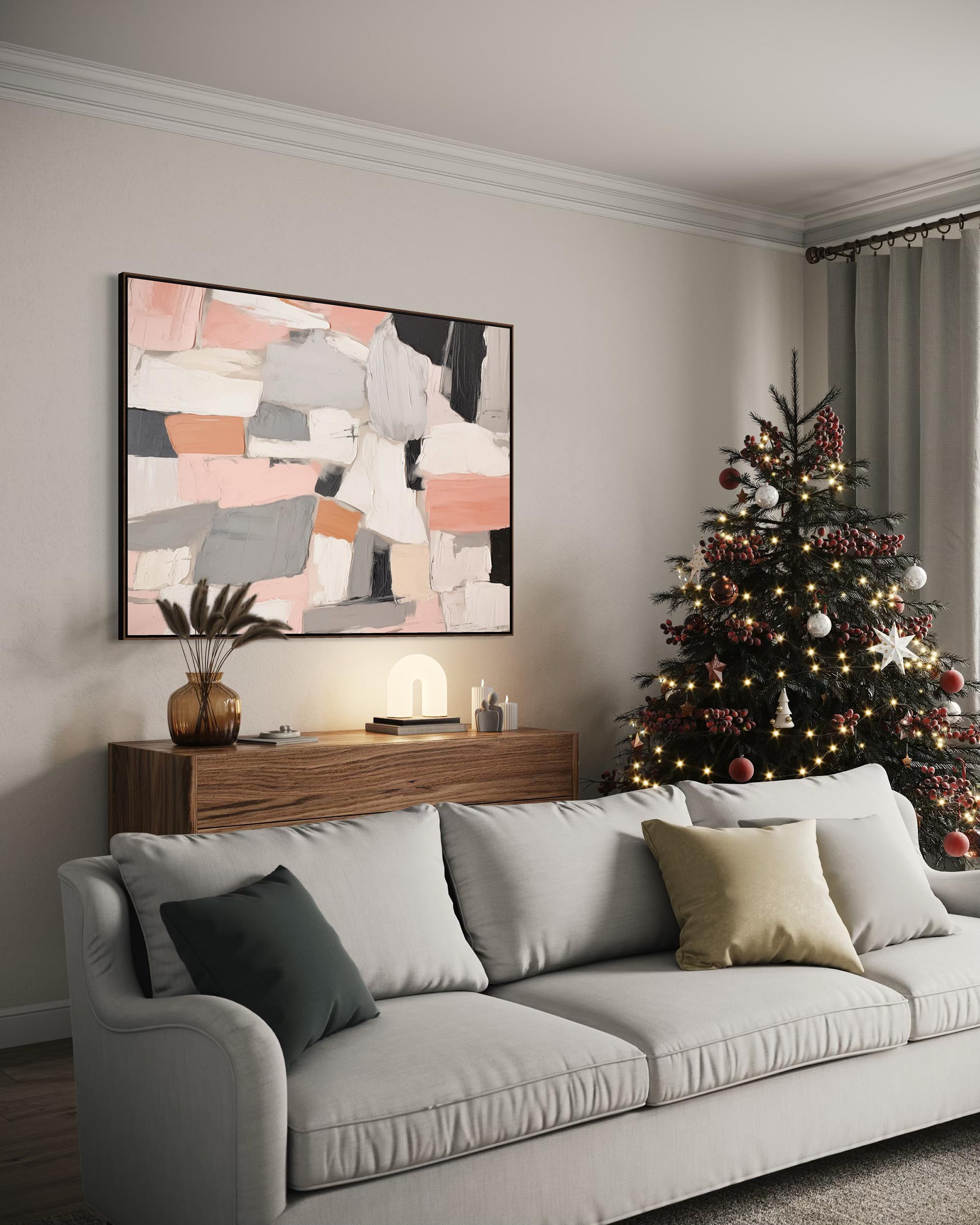 Living room with a Christmas tree, gray sofa, and abstract art on the wall.