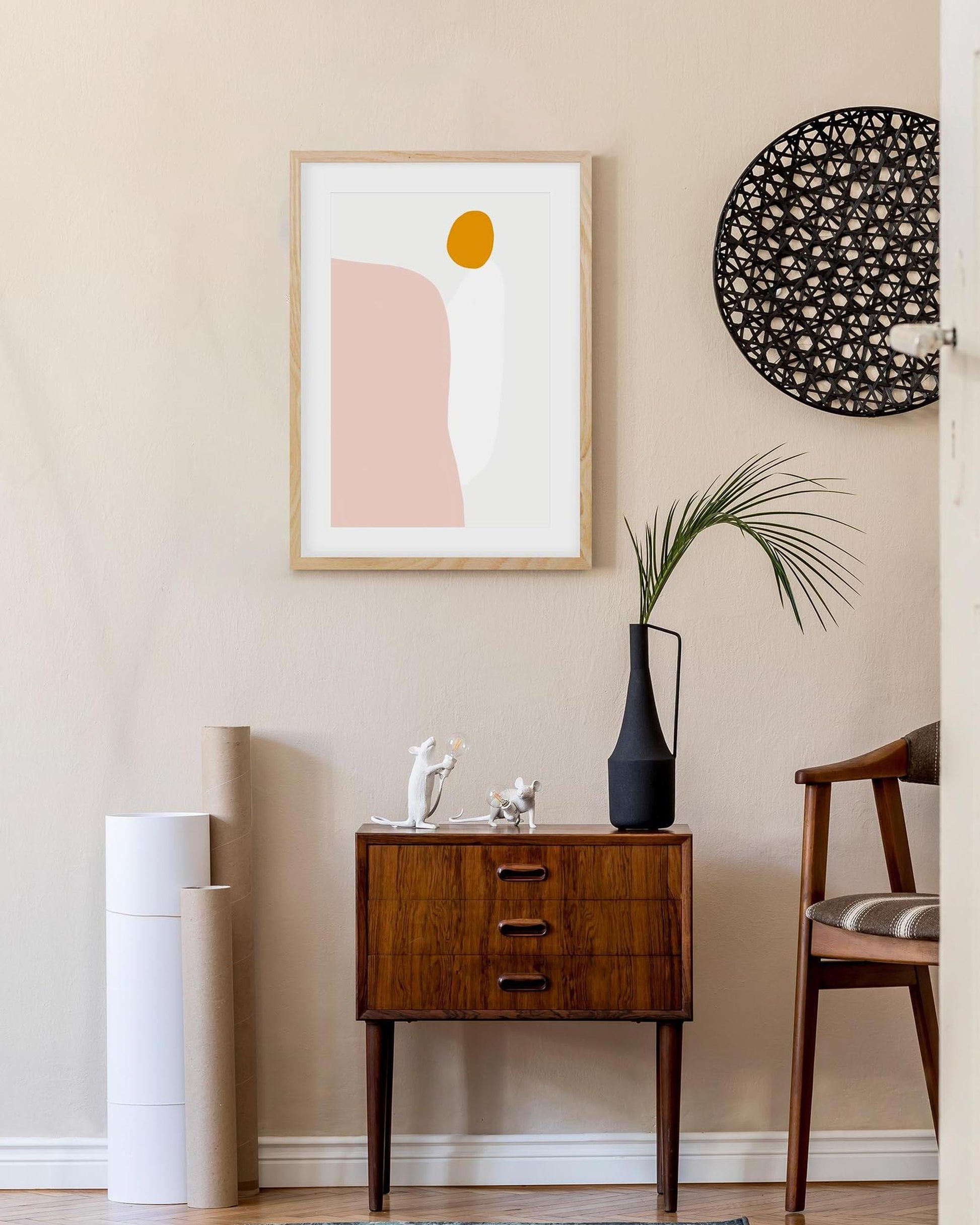 Modern interior with abstract art, side table, and decorative items.
