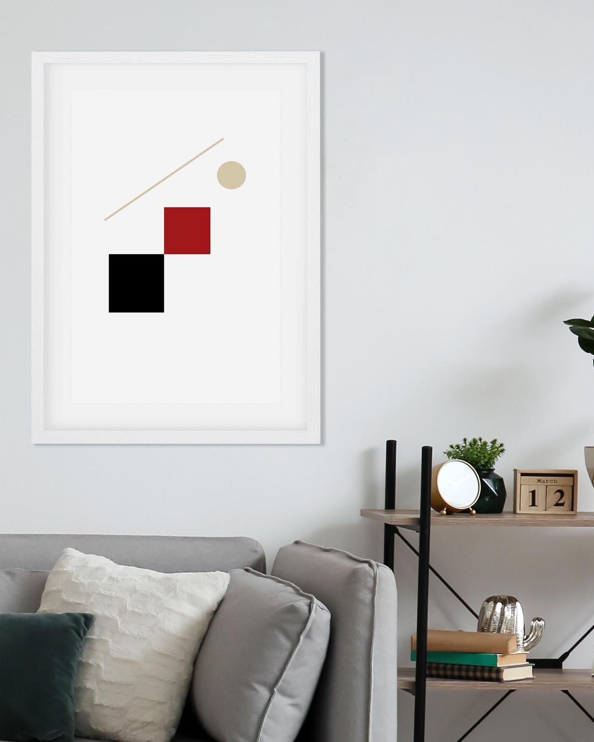 Modern abstract art piece on a wall above a sofa in a living room.