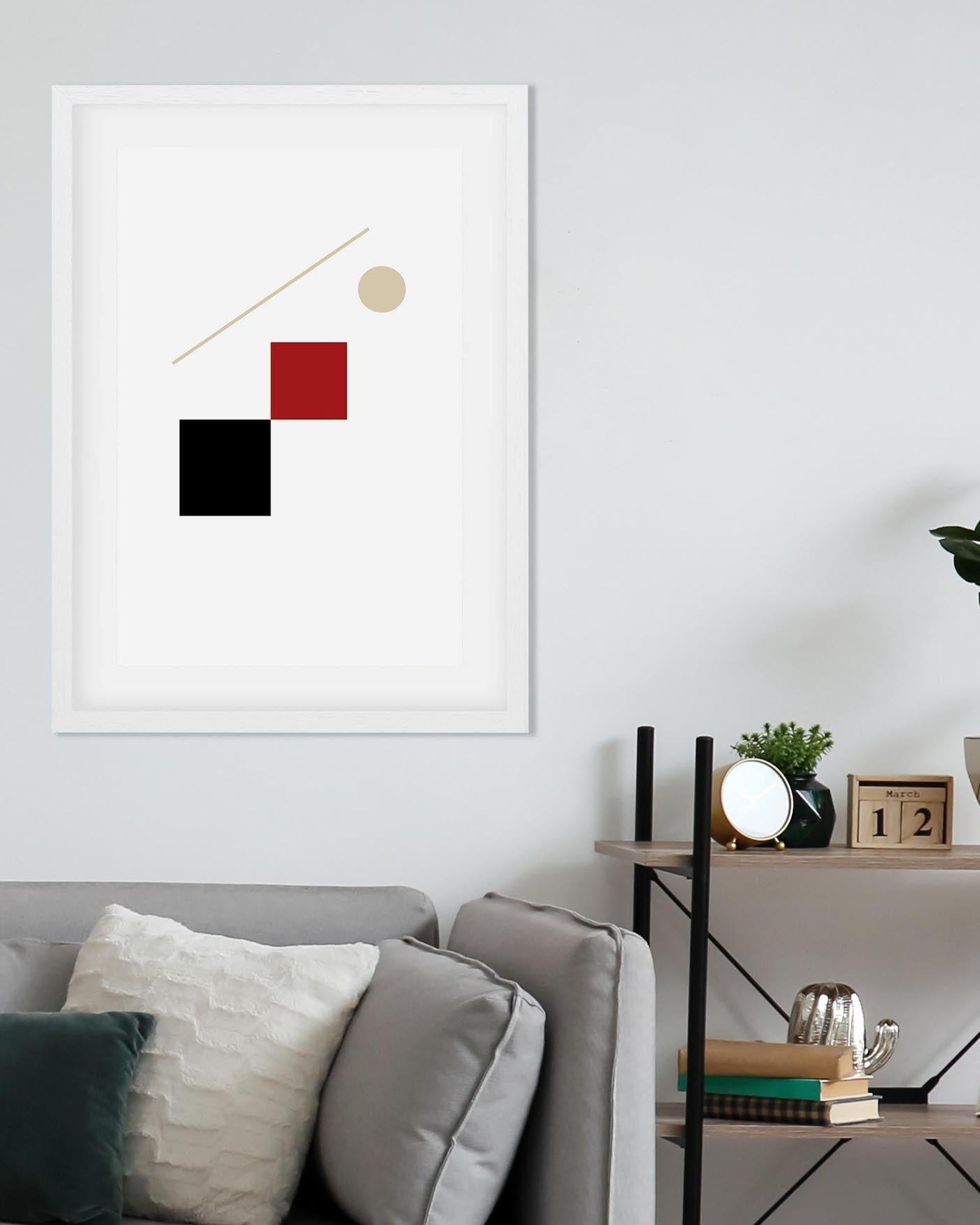 Modern abstract art piece on a wall above a sofa in a living room.