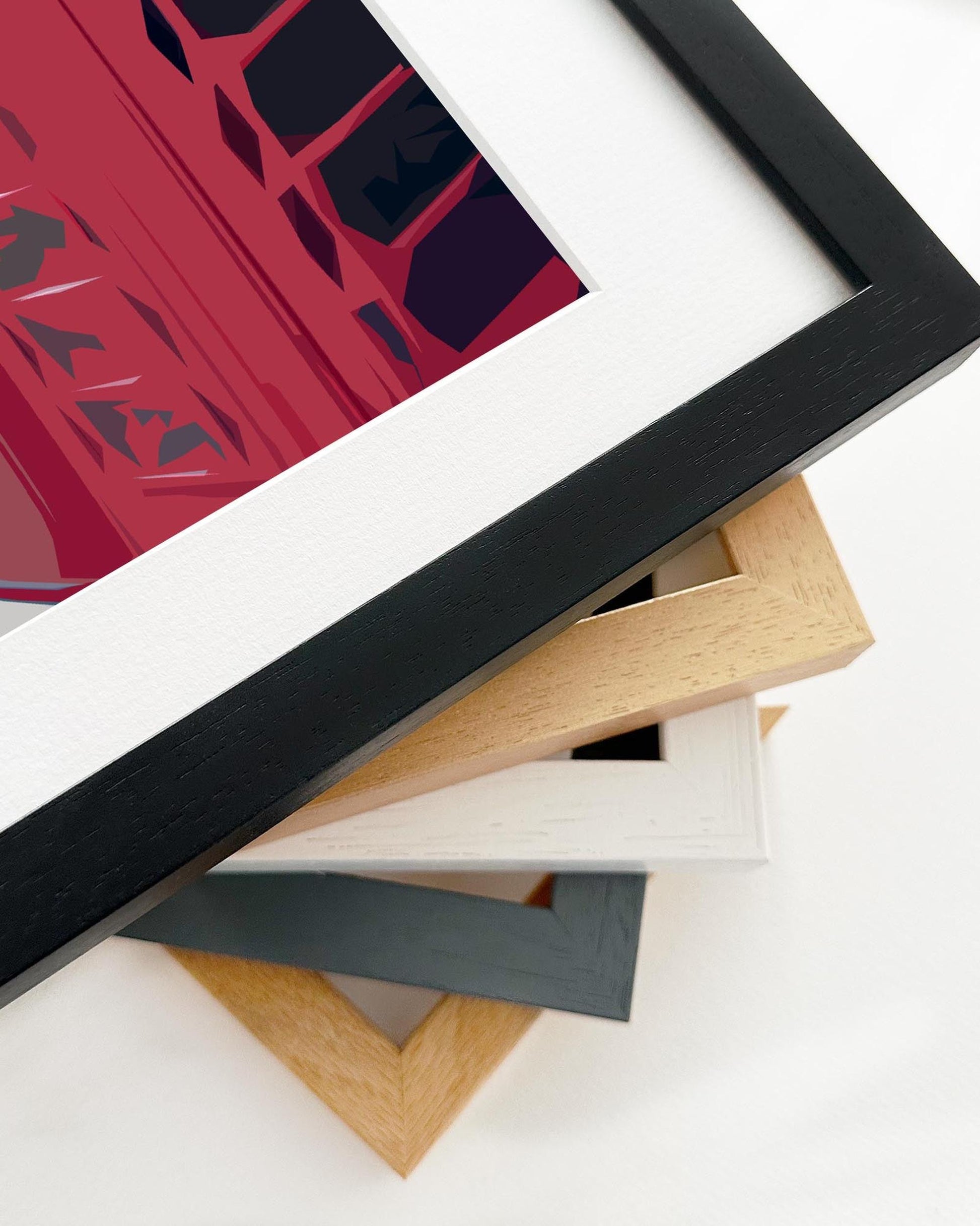 Framed artwork with a red abstract design on a white background