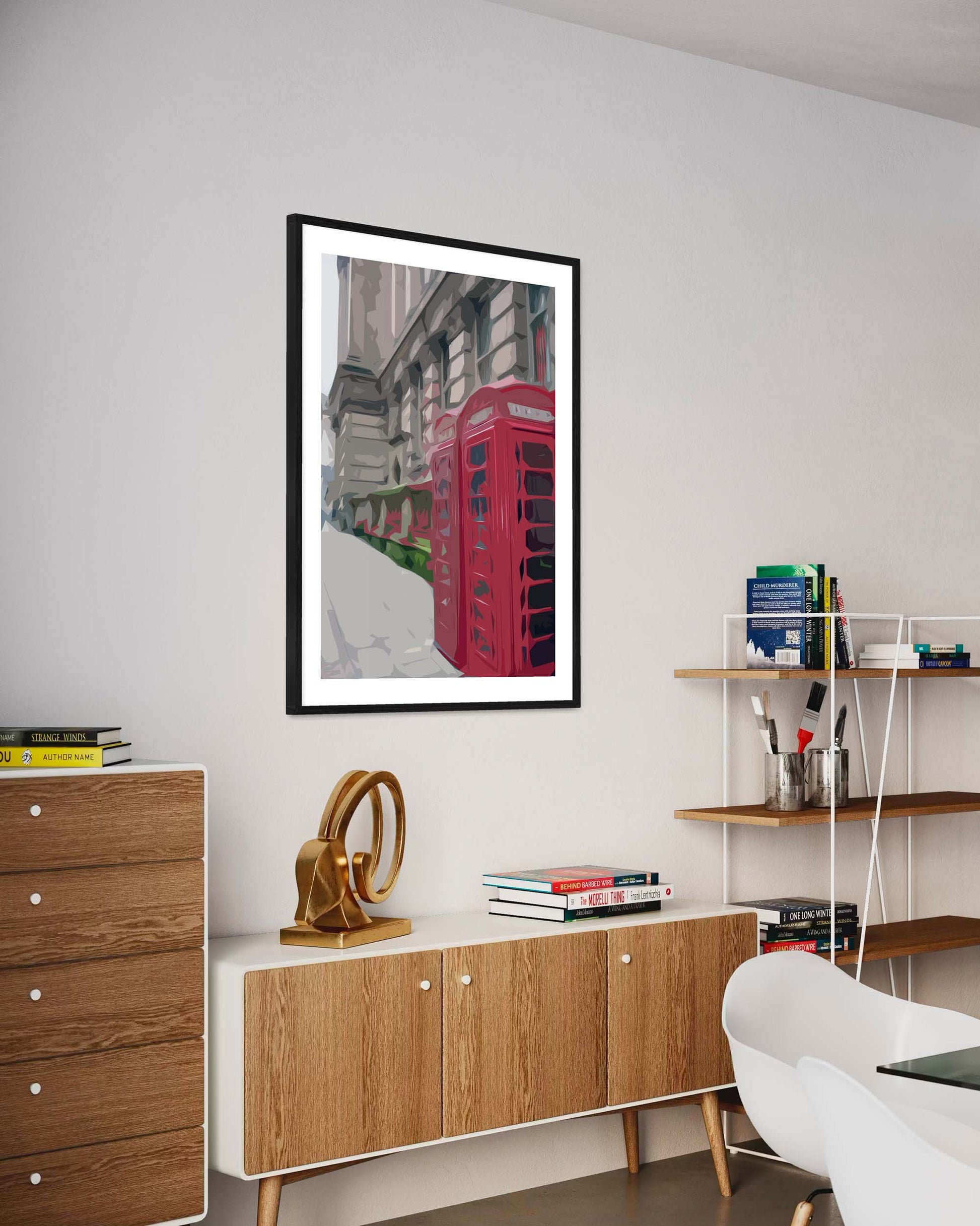Modern interior with wooden sideboard, white chair, and framed artwork of a red telephone box.
