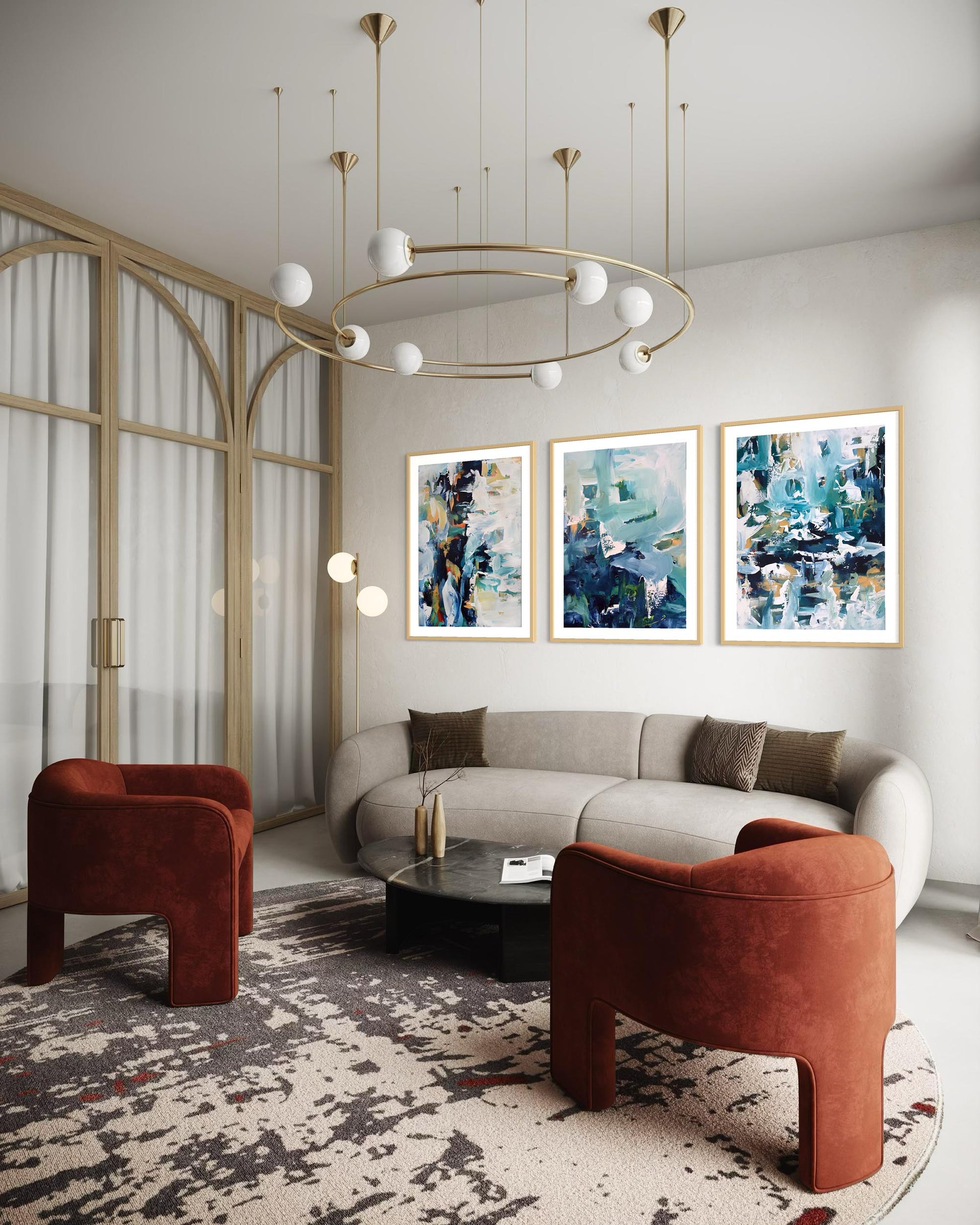 Modern living room with a round sofa, two armchairs, and abstract art on the wall.