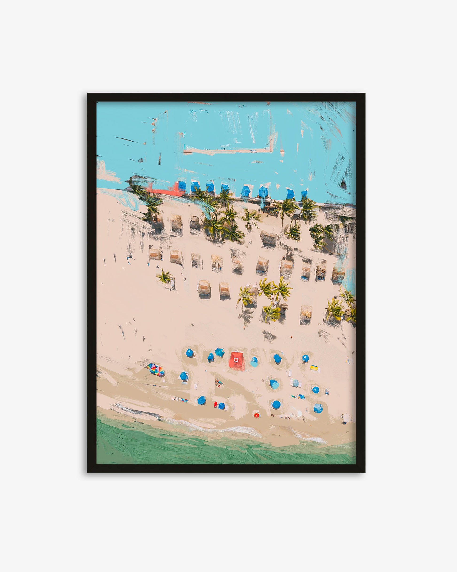 Framed artwork of a beach scene with lounge chairs and umbrellas.
