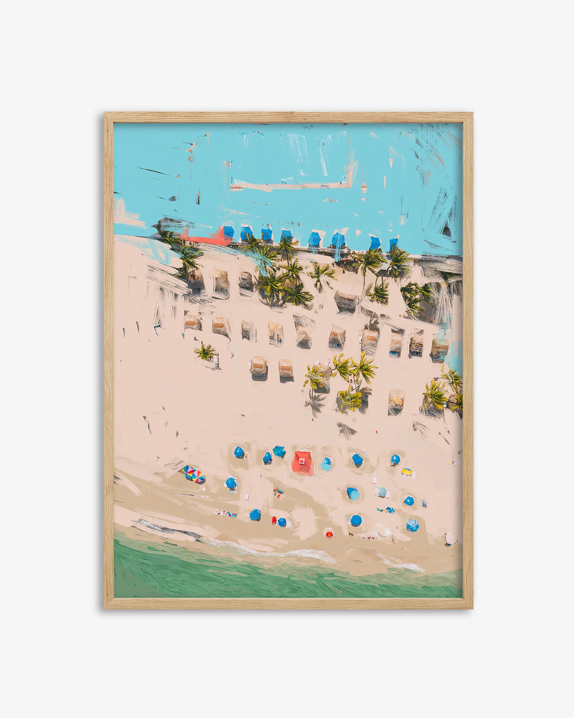 Framed artwork of a beach scene with buildings, chairs, and umbrellas.