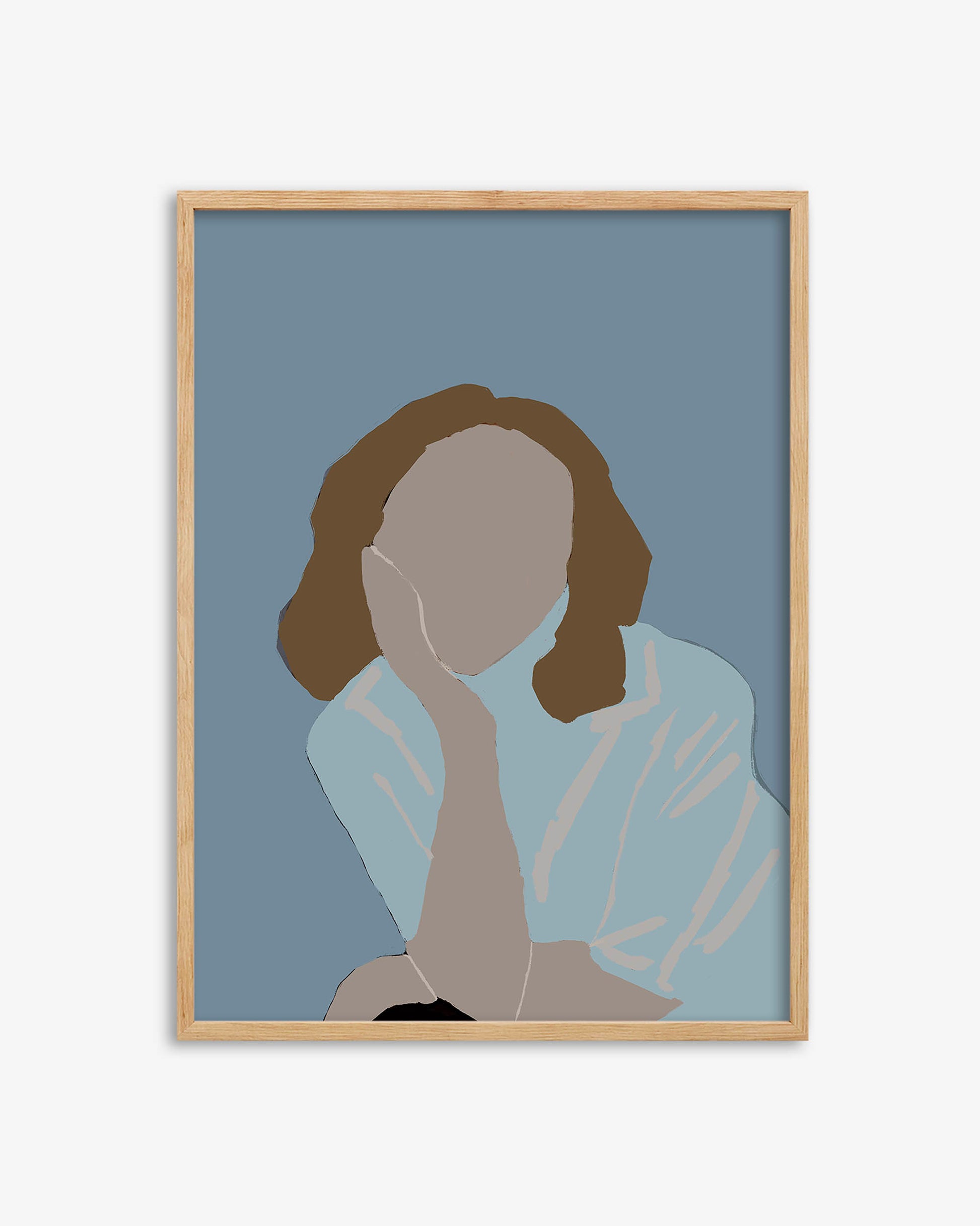 Framed artwork of a silhouette of a person with brown hair on a blue background