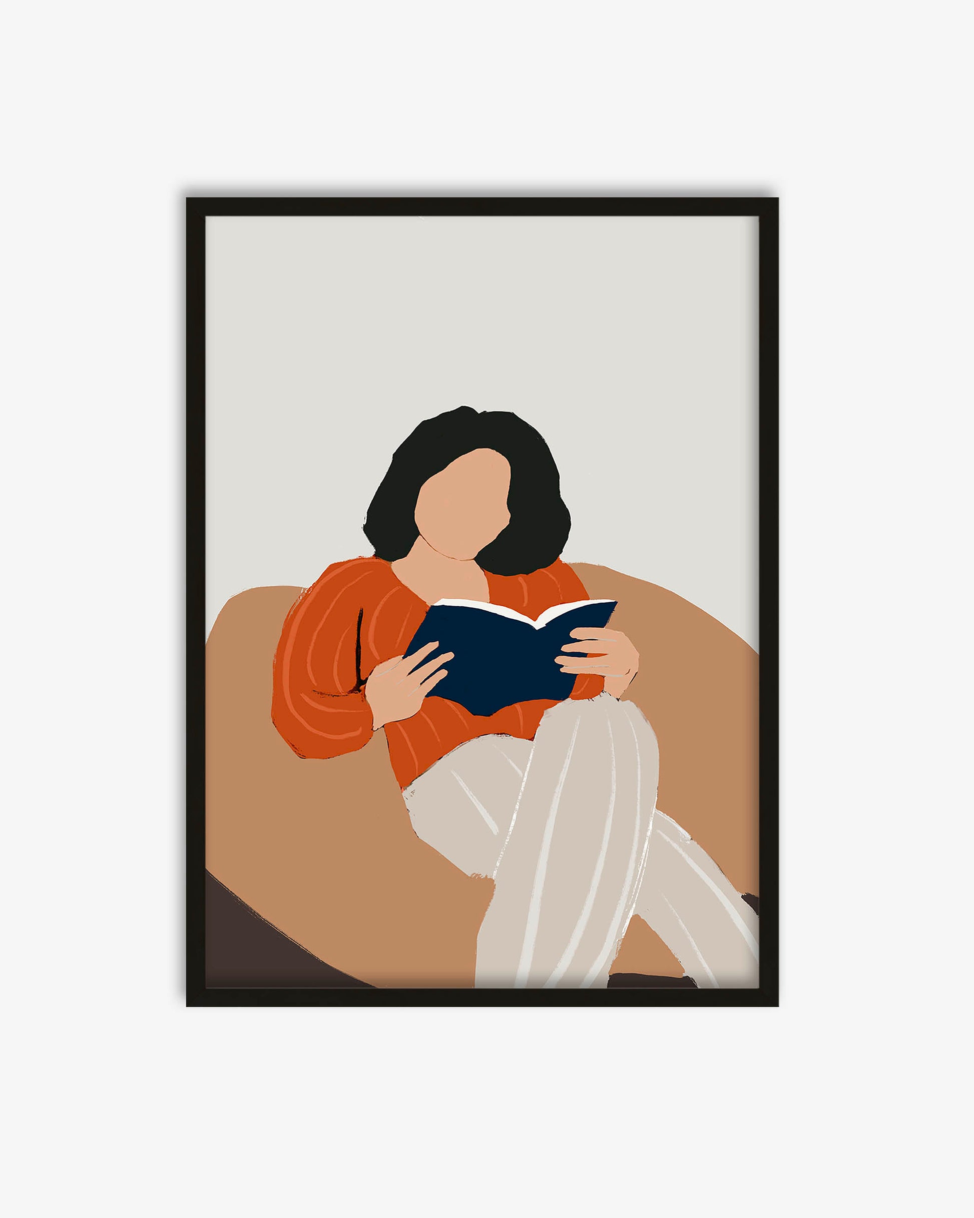 Framed artwork of a person sitting on a couch reading a book, with a minimalistic design.
