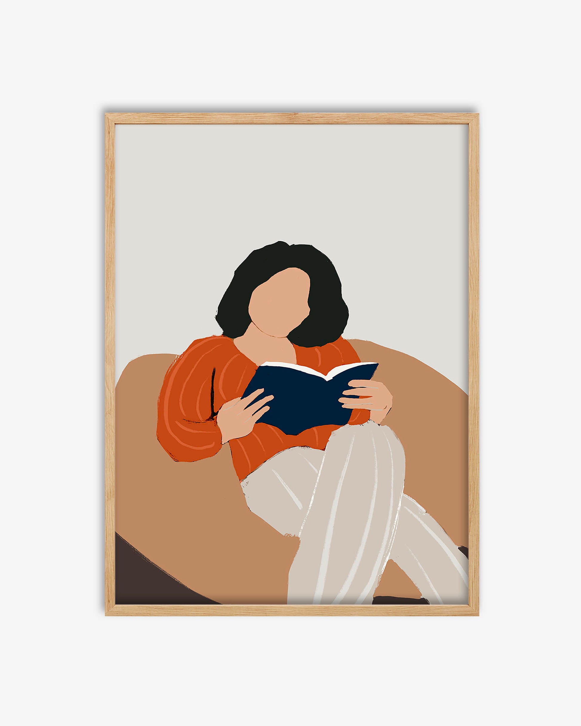 Framed artwork of a person reading a book on a couch with a minimalistic design.