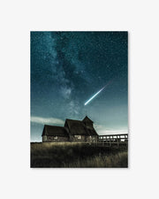 A house under a starry night sky with a comet visible.