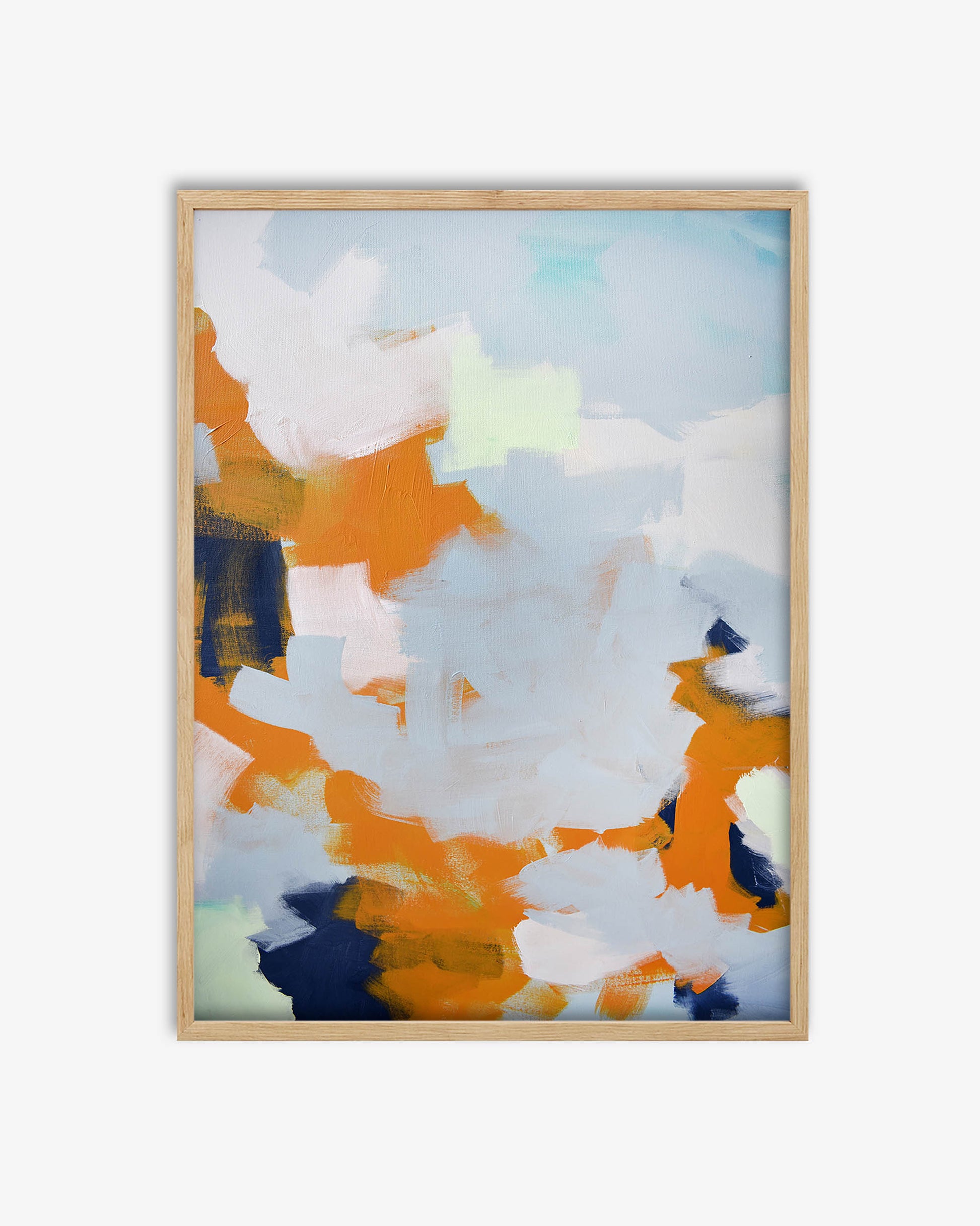 Abstract art print with orange, blue, and white colors in a wooden frame on a light gray background